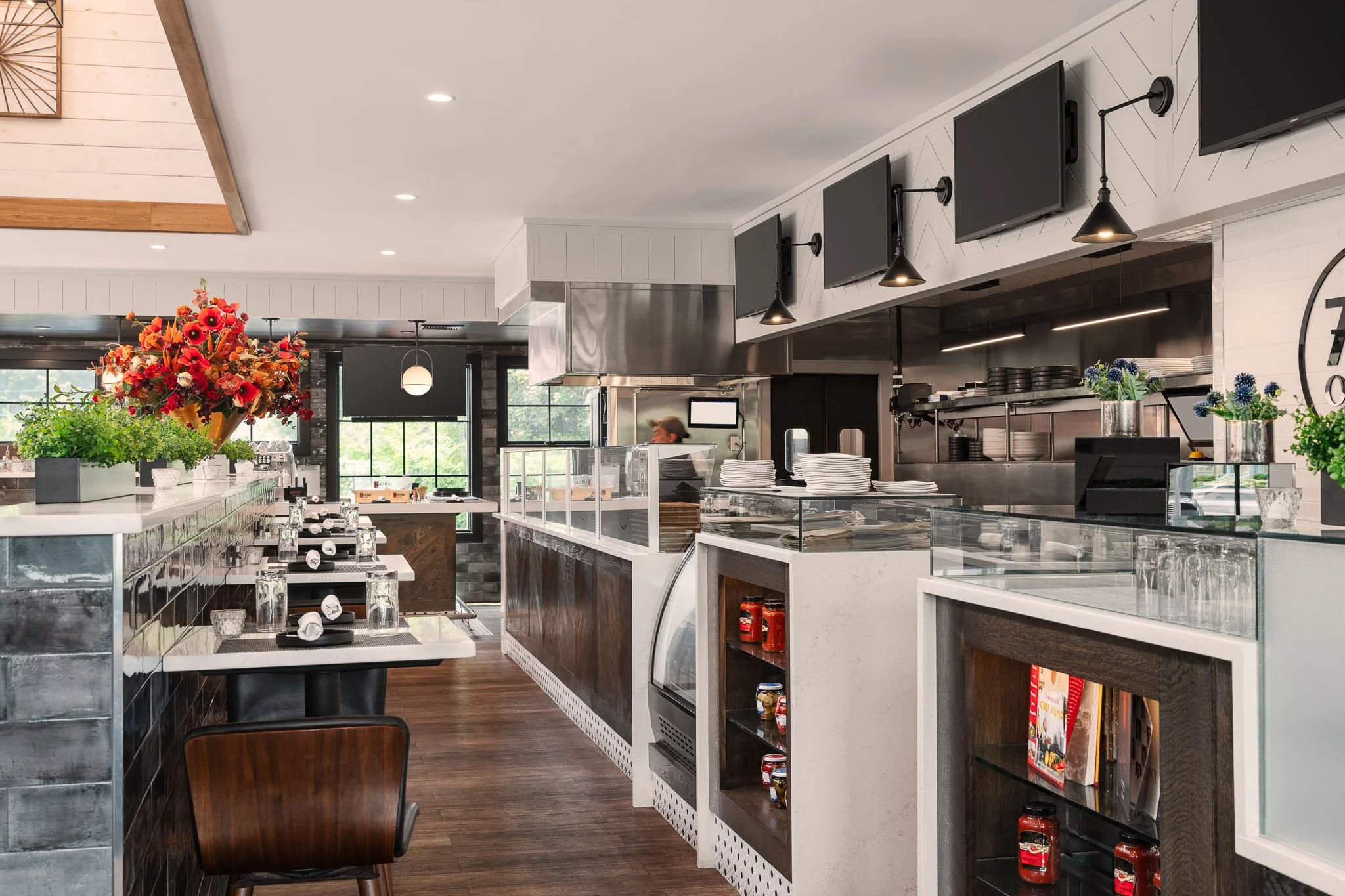 Front counter with display cases and the open kitchen beyond.