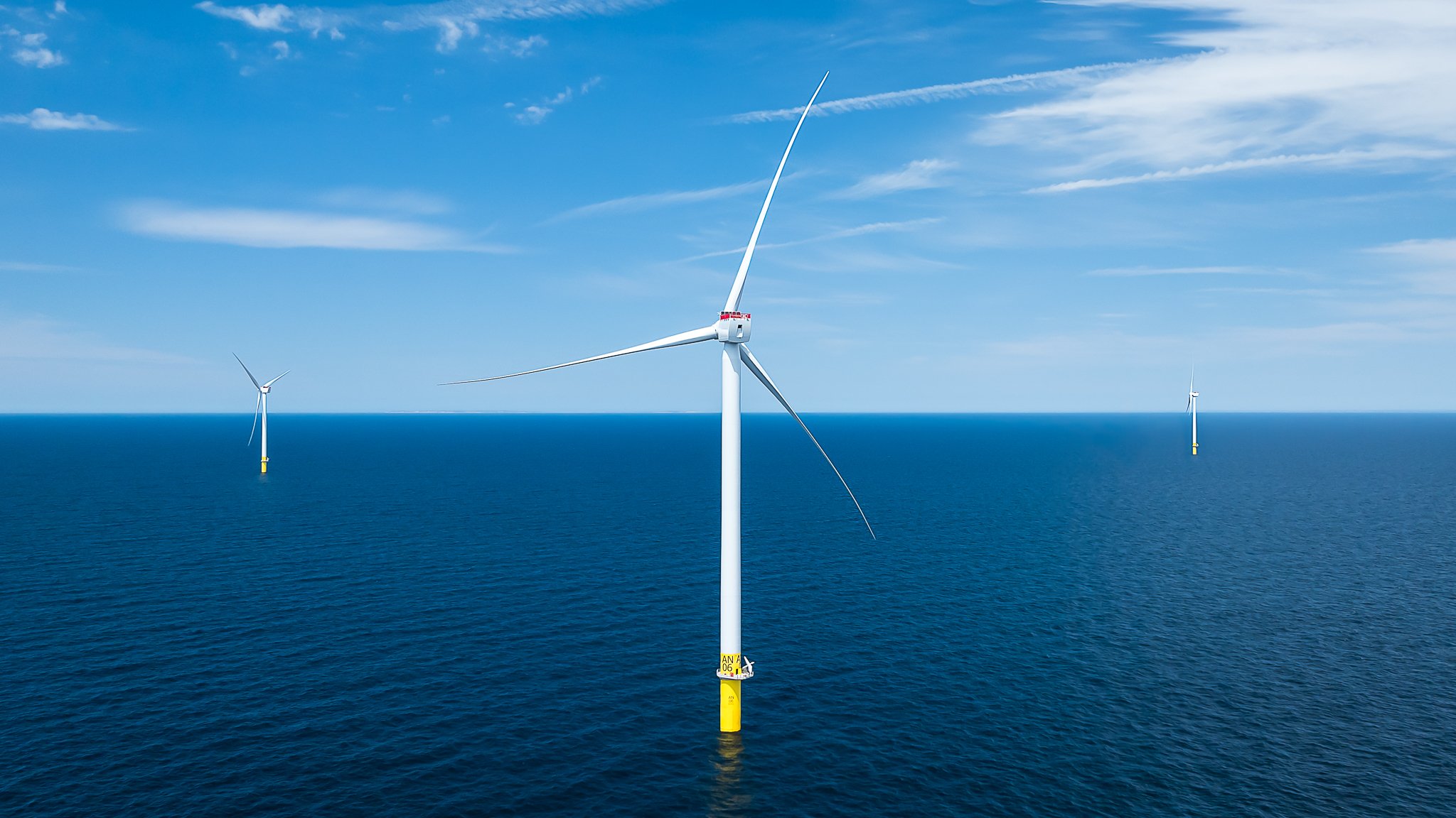 Offshore wind turbine at South Fork Wind Farm off Montauk, NY, with two more turbines on the horizon.