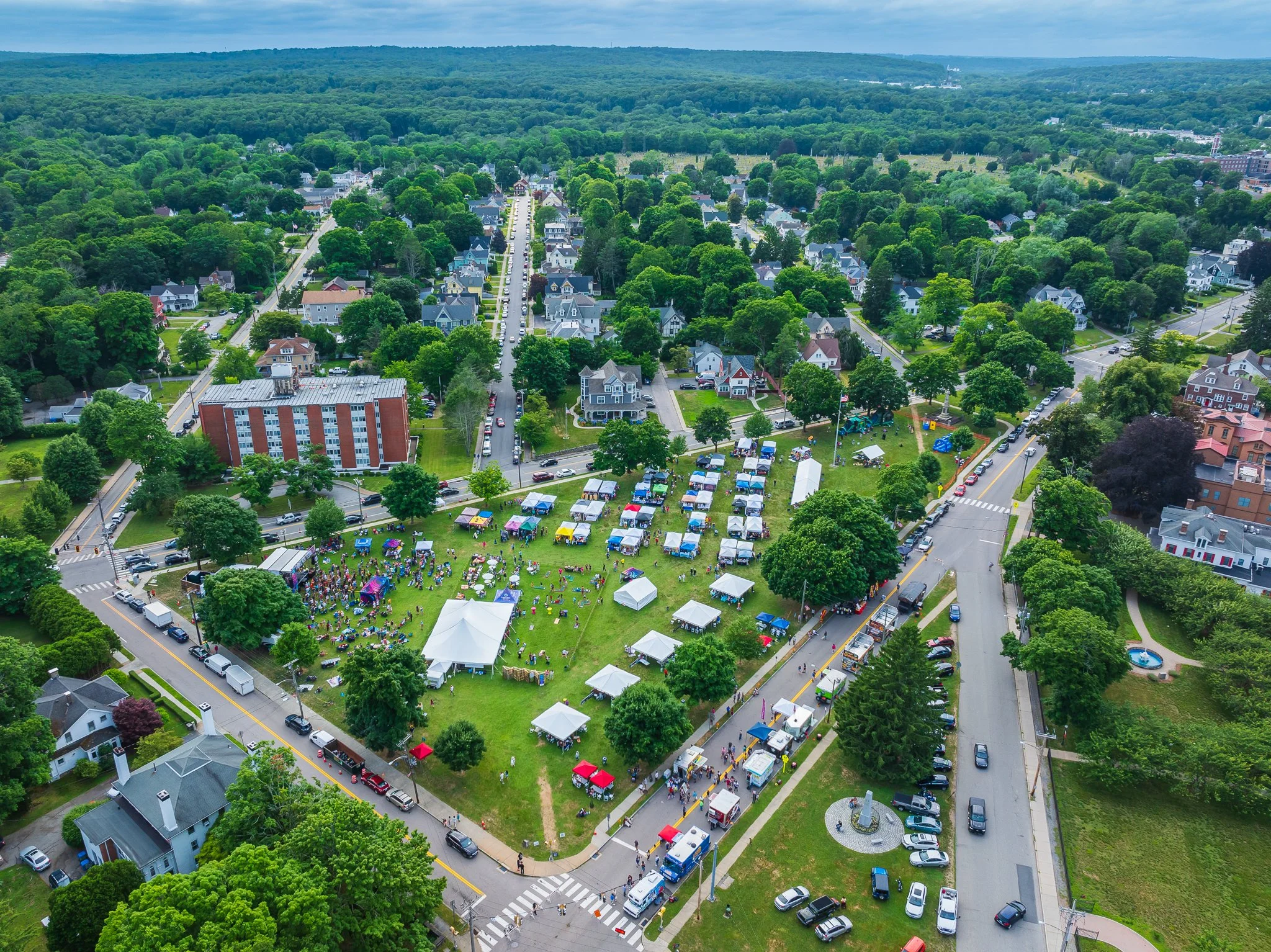 Aerial drone view of Rose Arts Festival tents and crowds on Chelsea Parade in Norwich, CT.
