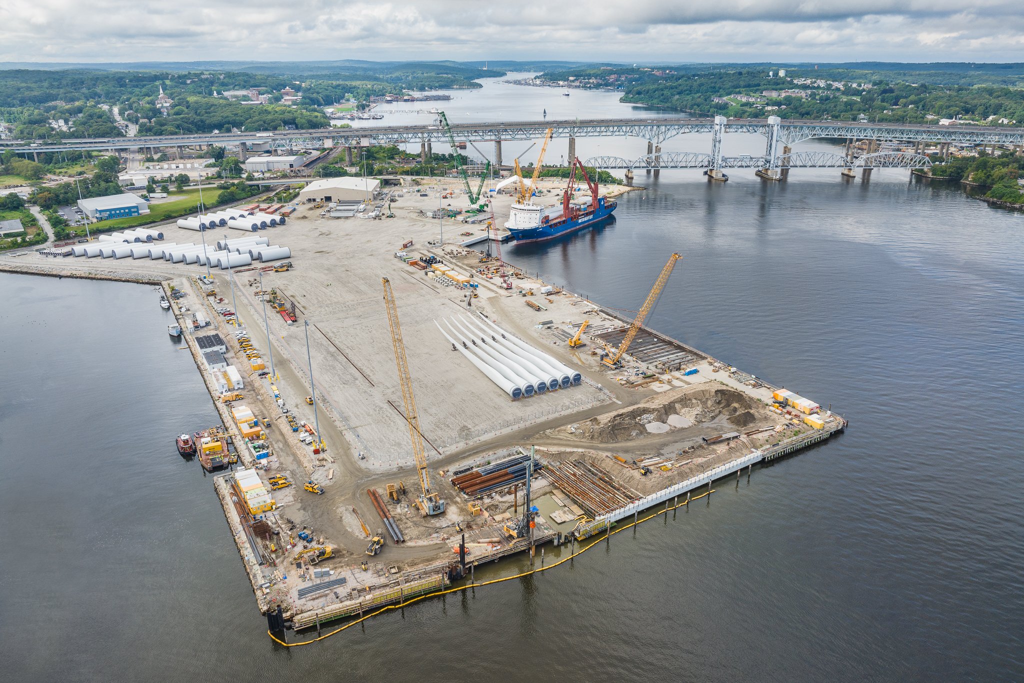 Aerial drone view of the pier with the Gold Star Bridge over the Thames River.