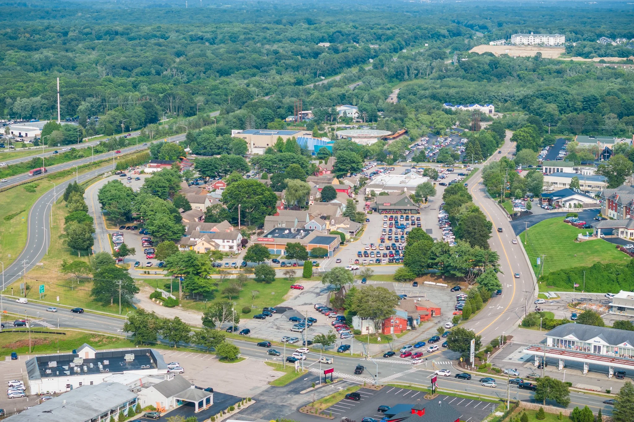 Aerial drone view of the Olde Mystic Village shopping center in Mystic, CT.
