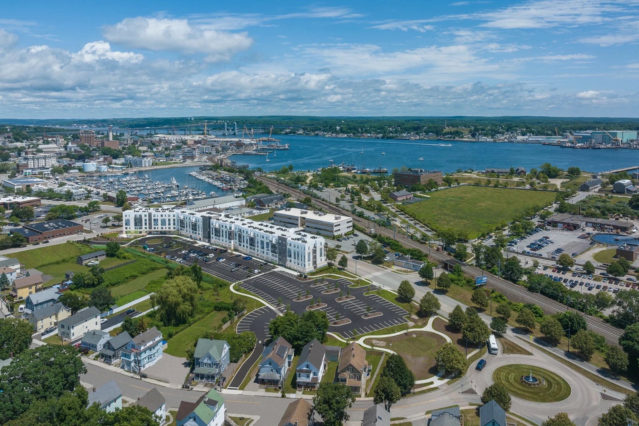 Elevated view of the building with a Thames River boatyard nearby.