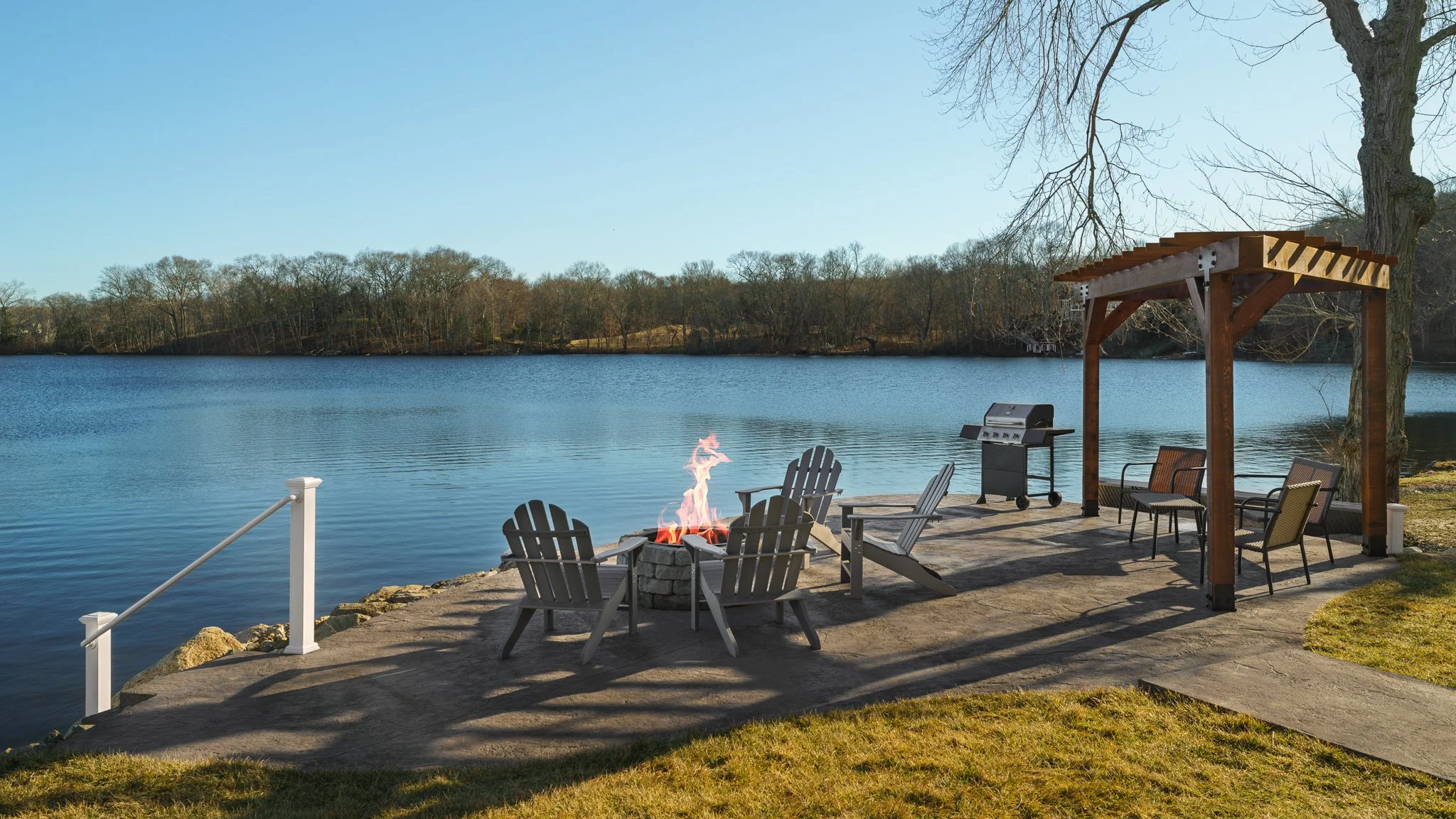 Lakeside fire pit, pergola and grill area.