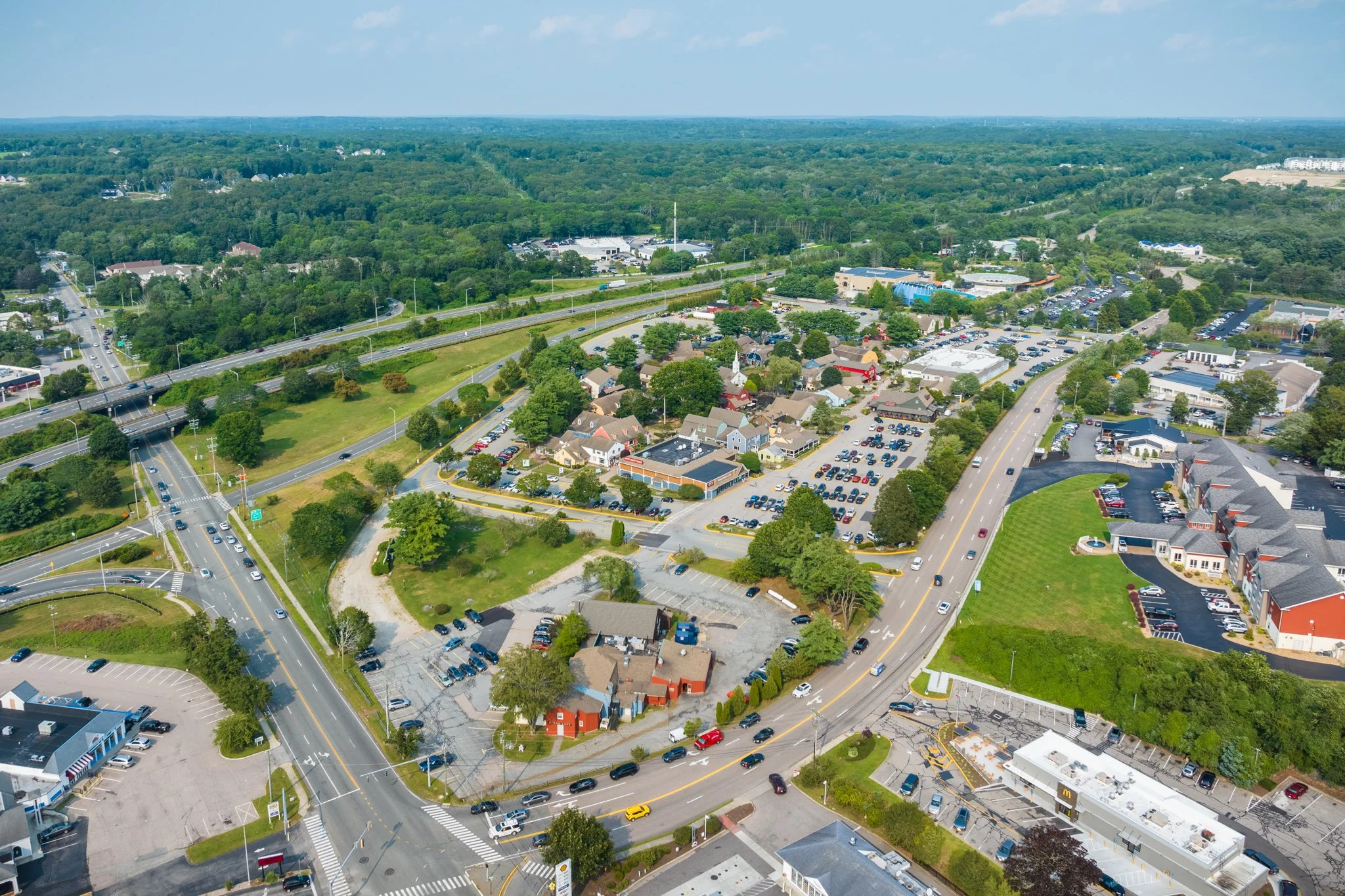 Aerial drone view of the village shops beside Interstate 95.