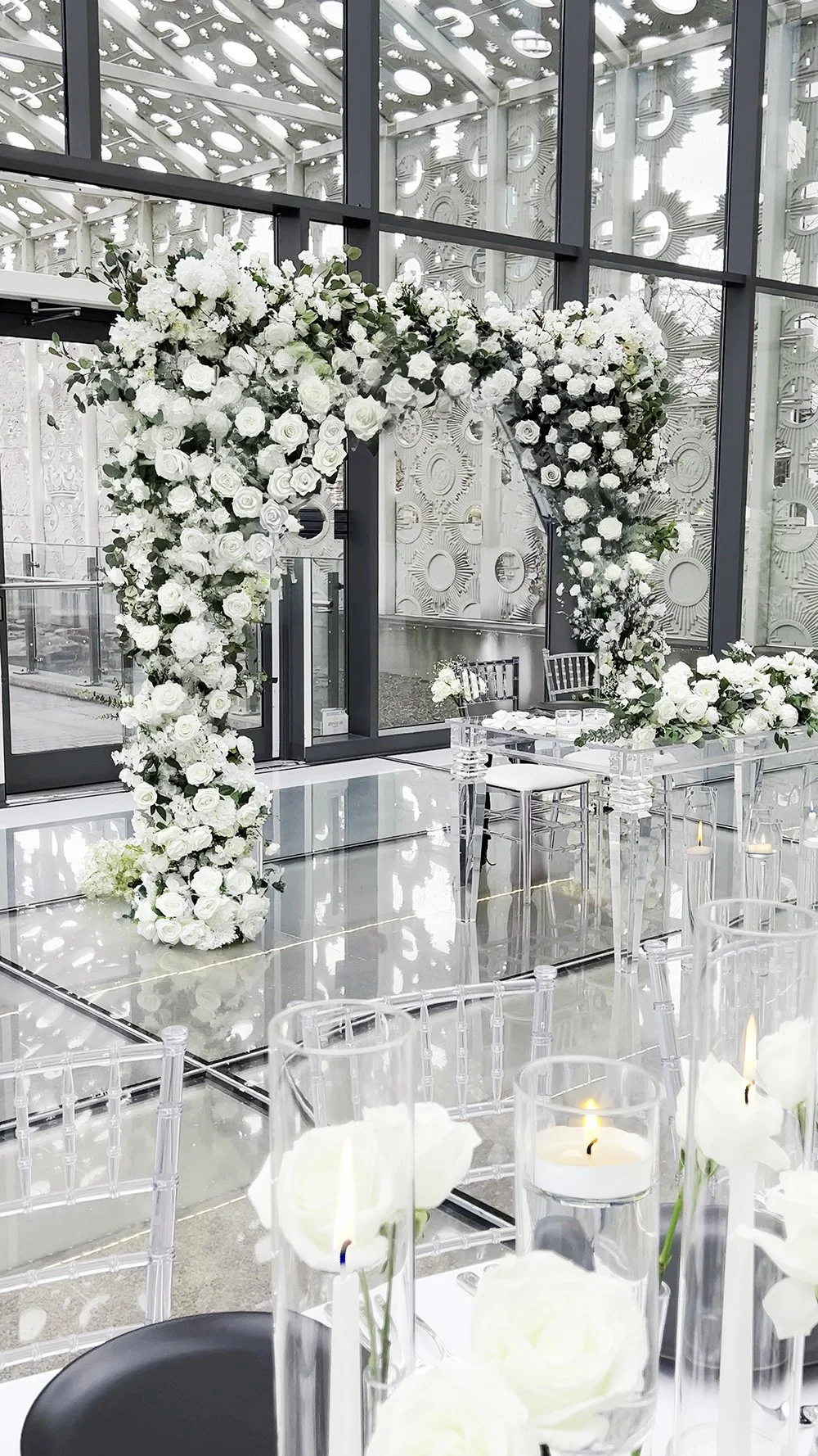 The closeup of the head table reveals a breathtaking sight, adorned with an abundance of candles that cast a warm and enchanting glow.