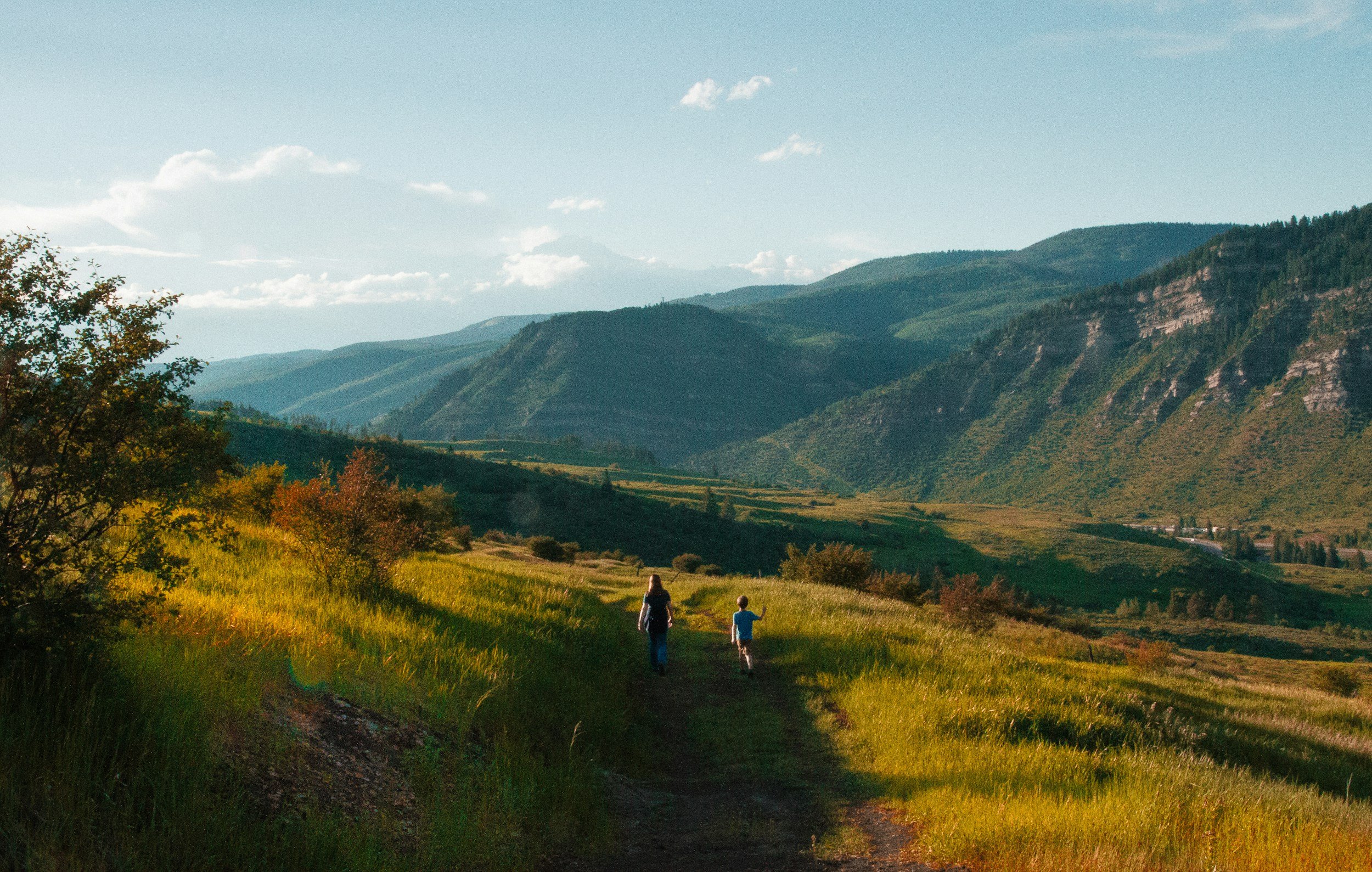 Colorado Mountains with people hiking on a path,radical impact