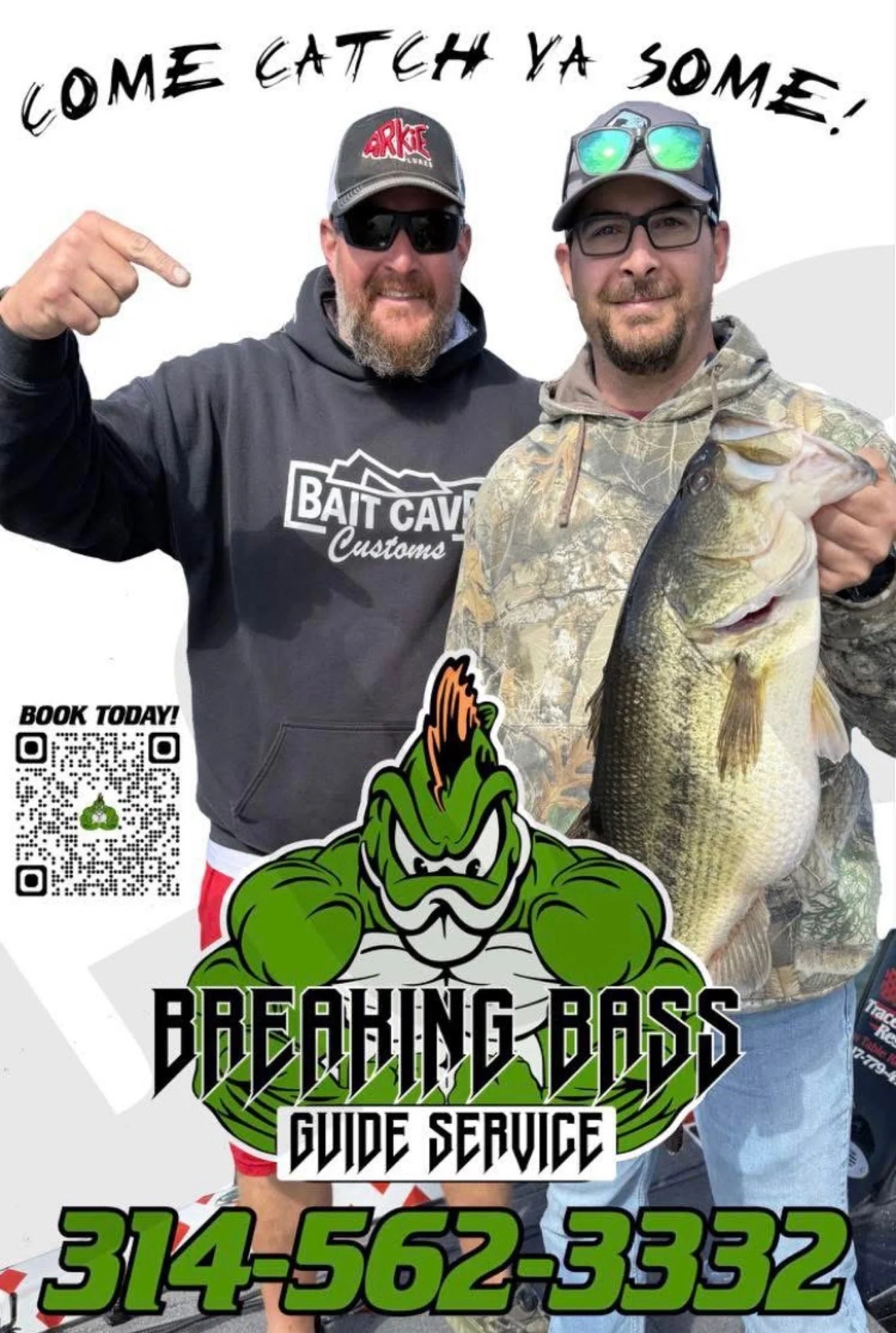 Two men are standing together, smiling. One is wearing sunglasses, a black hoodie with a 'Bait Cave Customs' logo, and a baseball cap. The other is wearing glasses, a camouflage hoodie, and a baseball cap with sunglasses on it. The man in the camouflage hoodie is holding a large fish, likely a bass. Text on the image reads, 'Come catch ya some!' and 'Breaking Bass Guide Service' with a phone number and a QR code visible.
