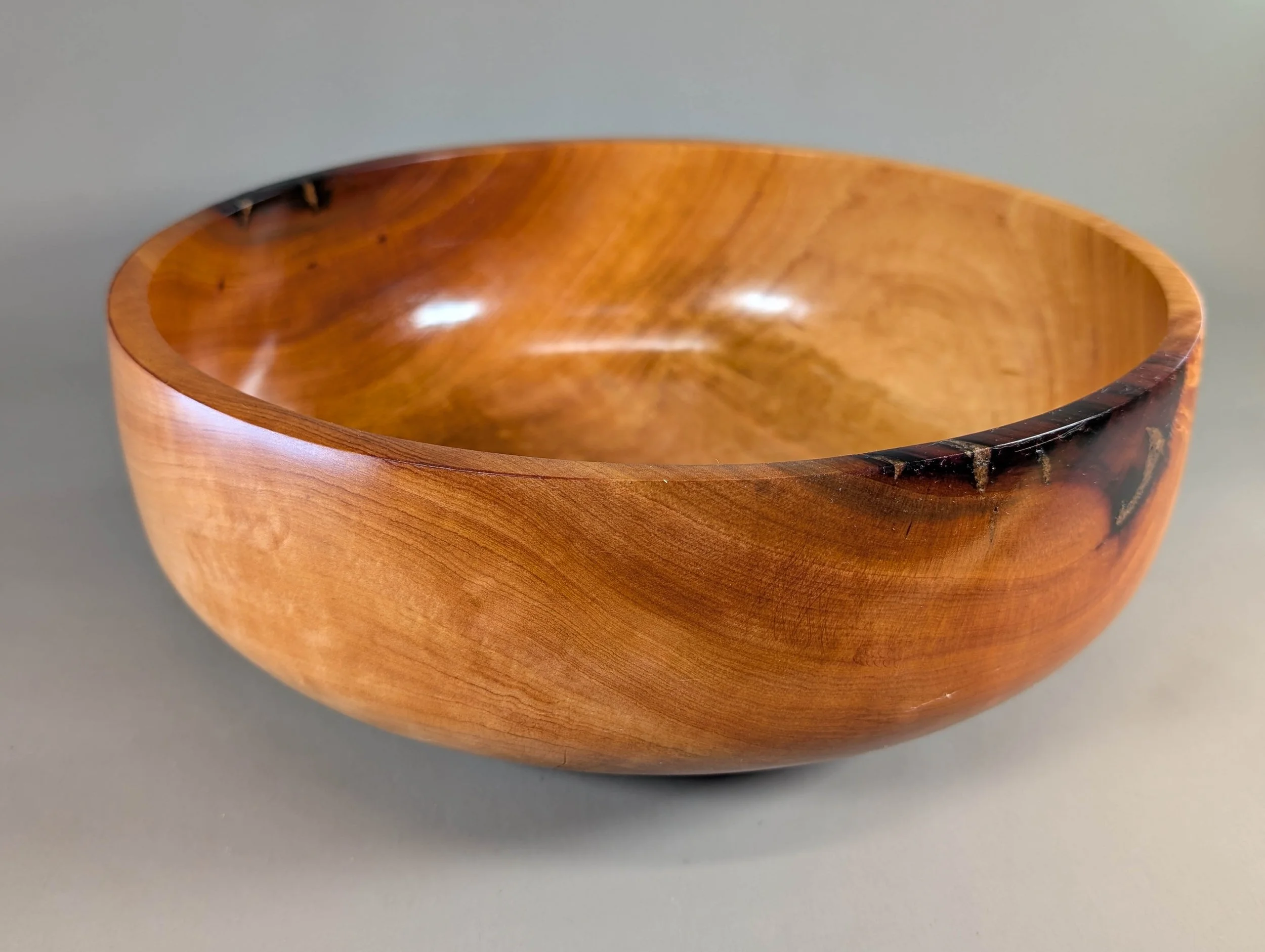 Madrone Salad Bowl - In the world of woodturning, a flawless Madrone bowl of this size is a true rarity. Due to the wood's extreme instability and tendency to crack during the drying process, few such pieces exist. This bowl, with its graceful, eleva