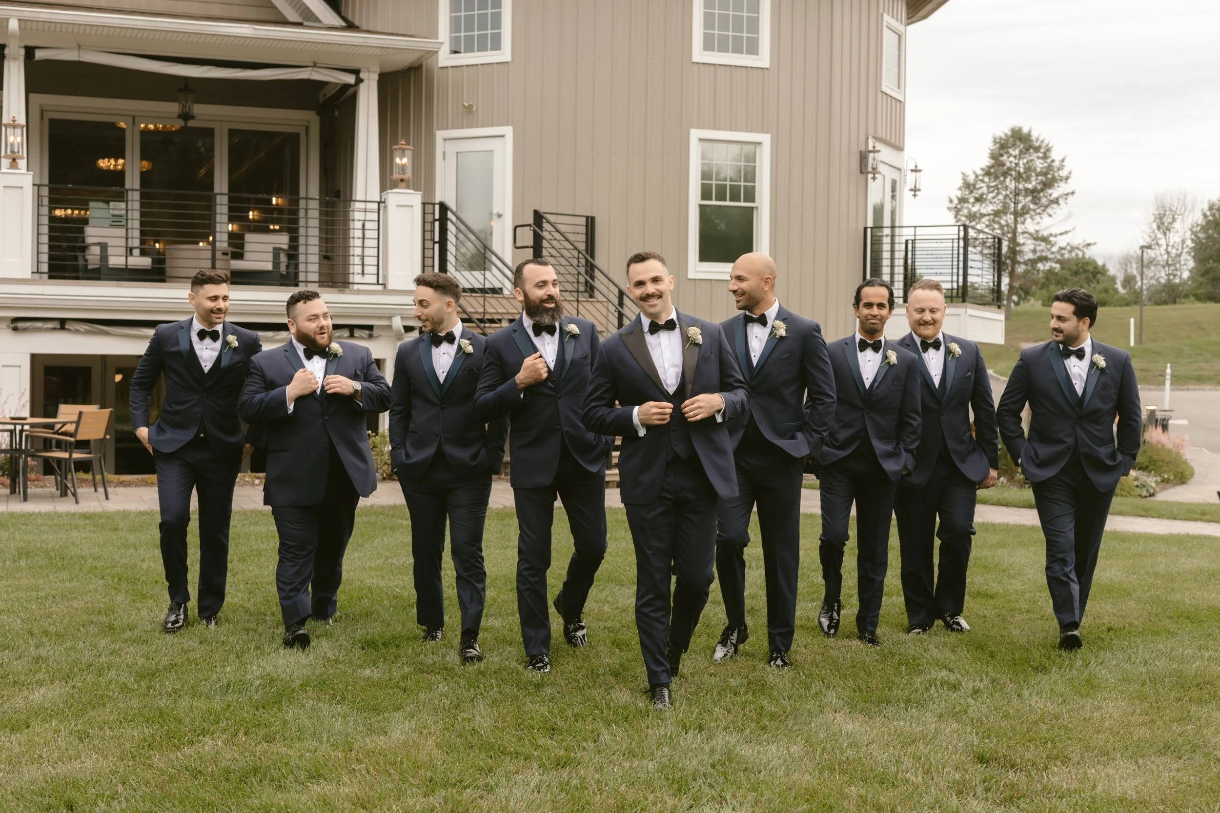 Groom in navy tuxedo for Jersey City wedding rental