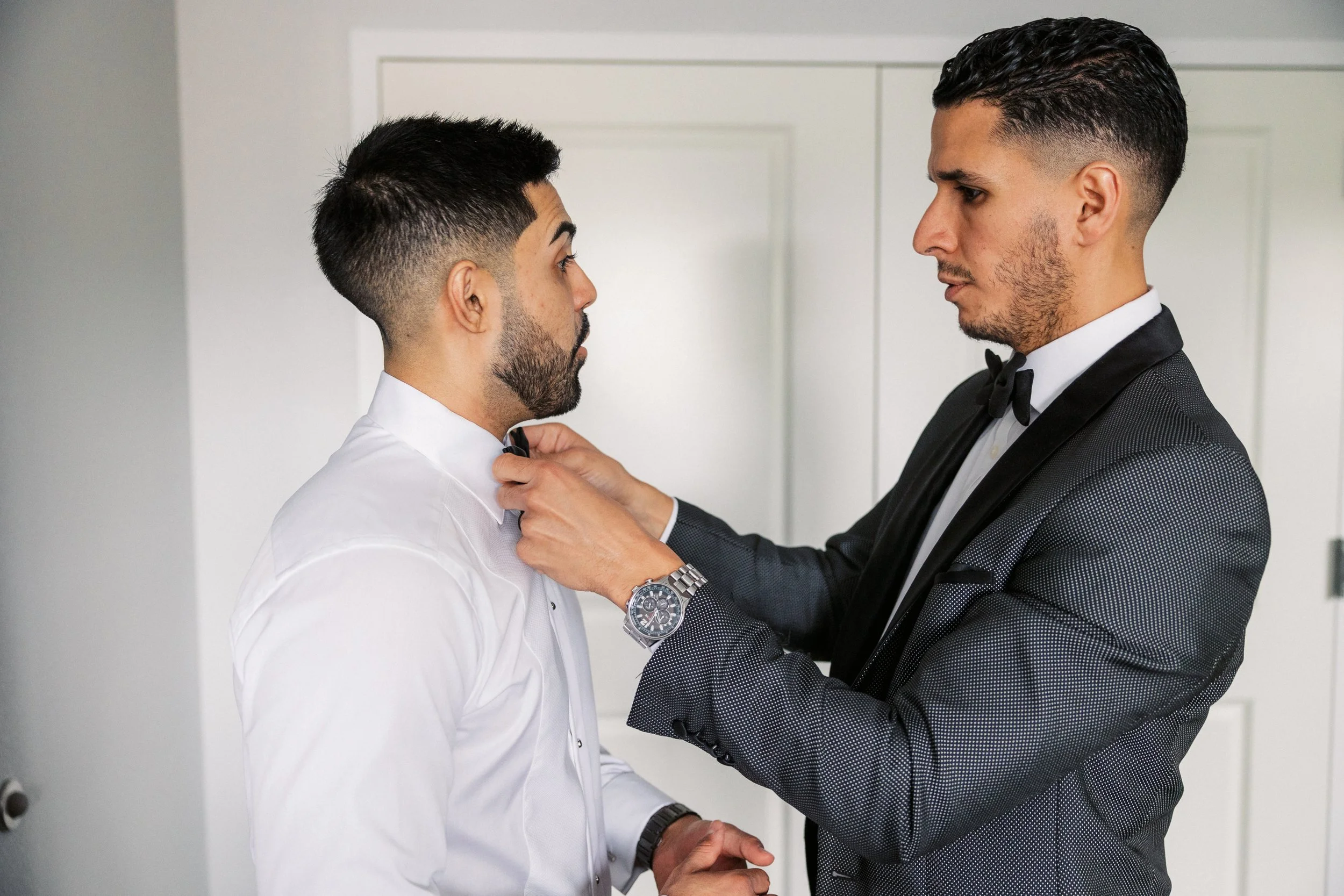 day-of wedding tuxedo service NJ groom and groomsmen getting ready