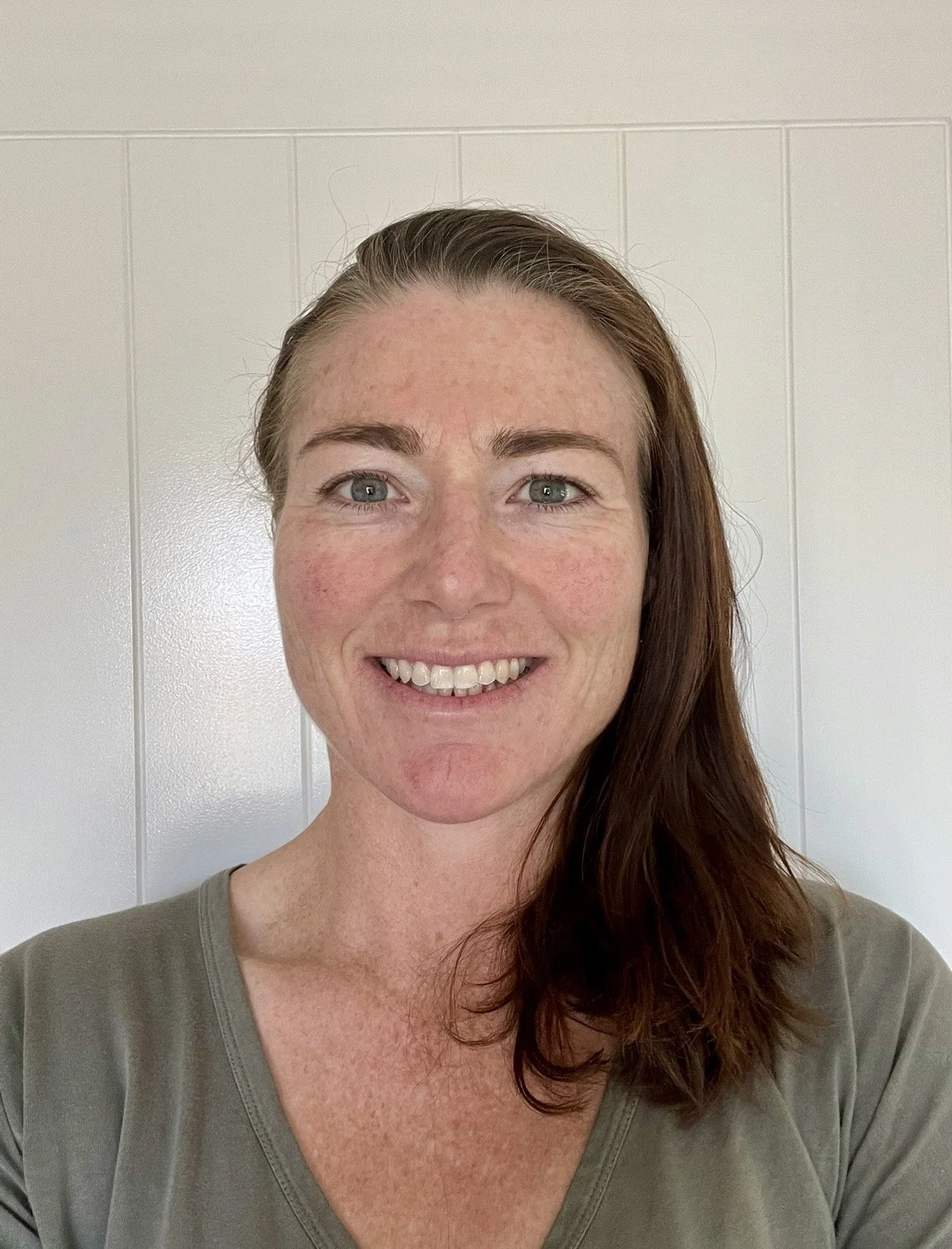 image of joanne amyes wearing a green top