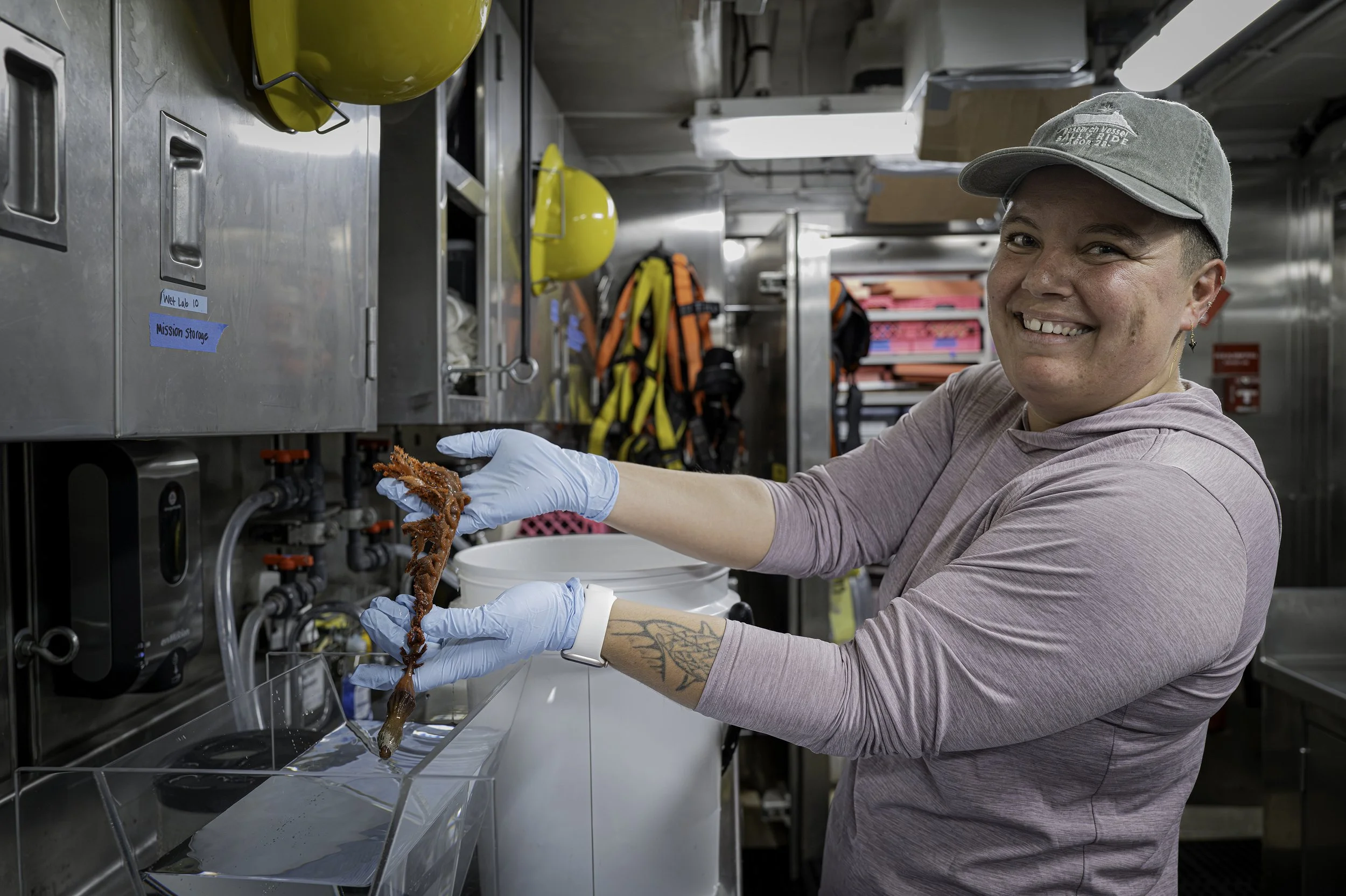 Sara holding a sea pen collected on Dive 01 of NOAA EX2503