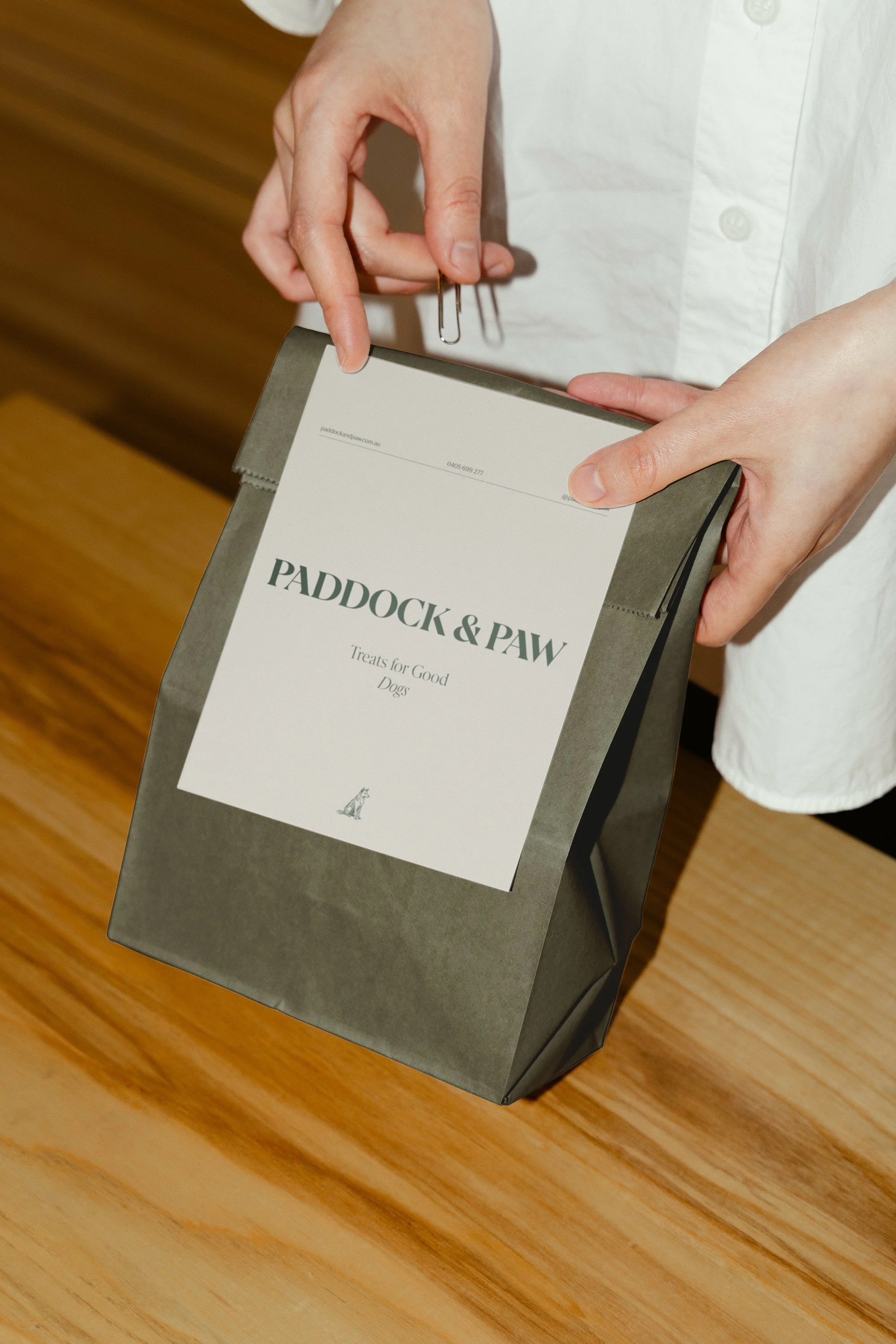 Brand identity and packaging design for Paddock & Paw, creating a premium and welcoming brand for a luxury dog retreat inspired by nature and thoughtful care.