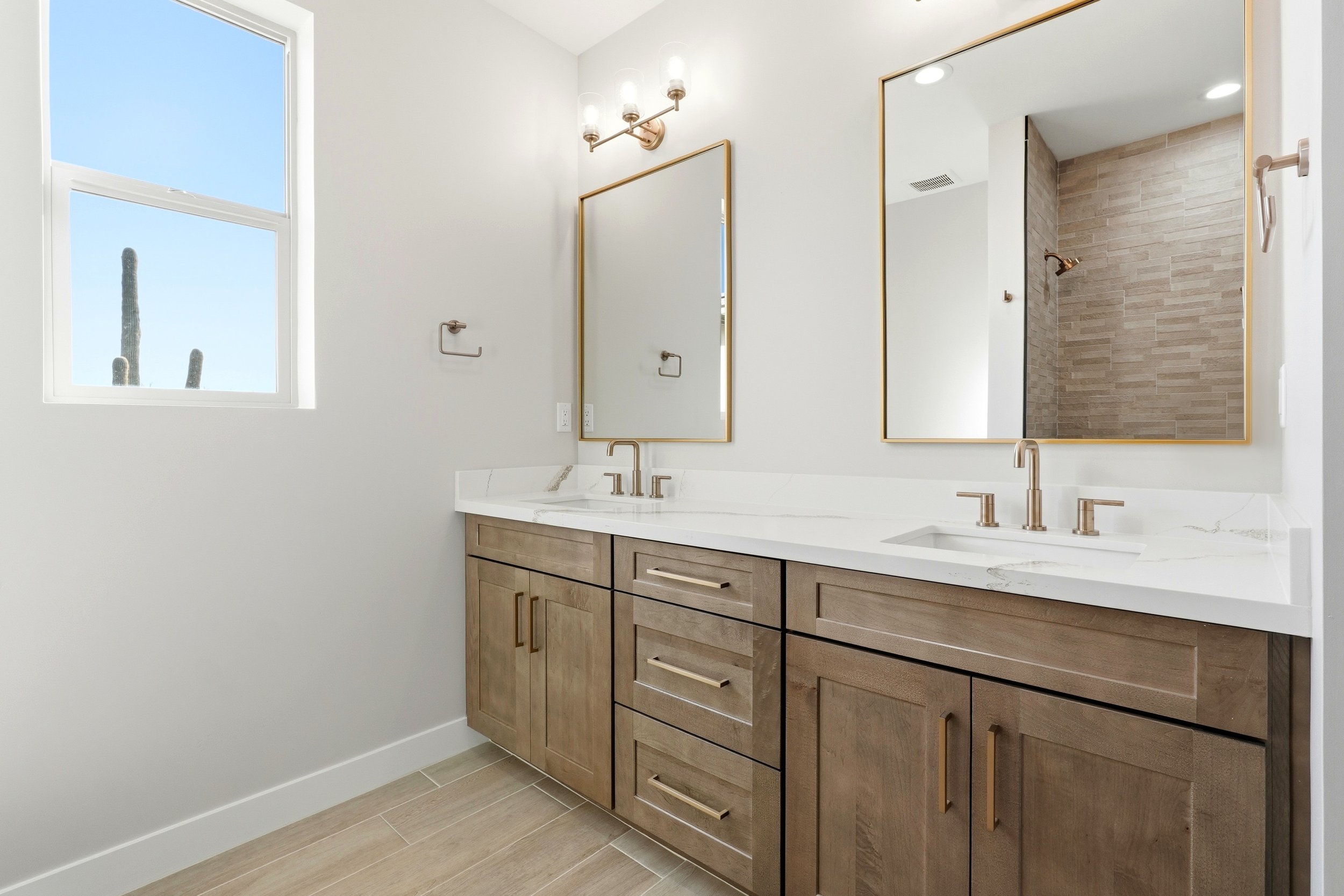 Luxury home office with custom built-ins, large windows, and sophisticated design