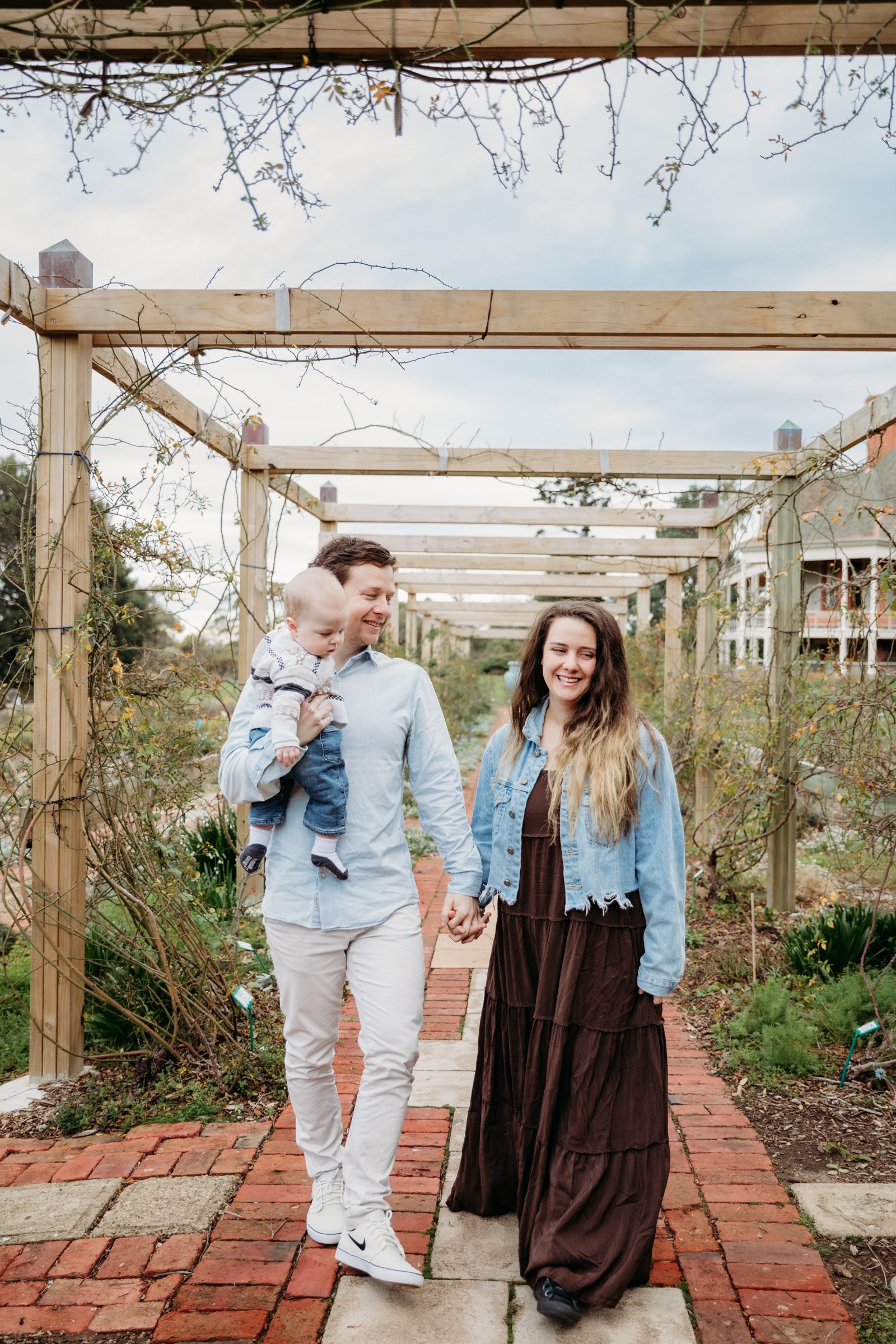 adelaide-maternity-photographer-family-walking-garden.jpg
