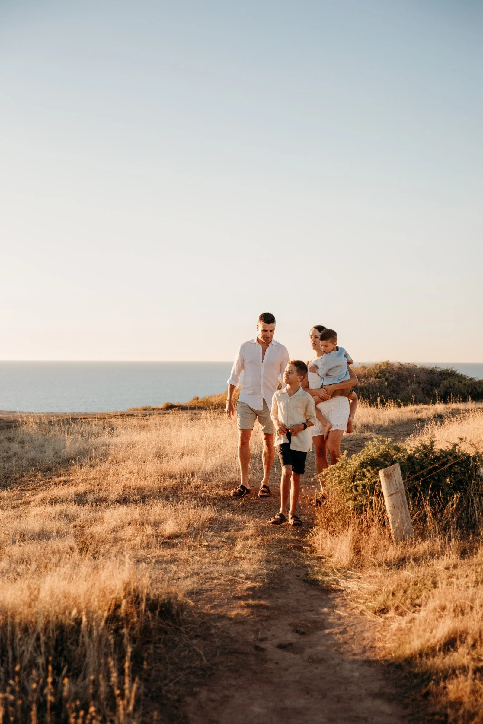 adelaide-family-photographer-family-walking-coastal.jpg