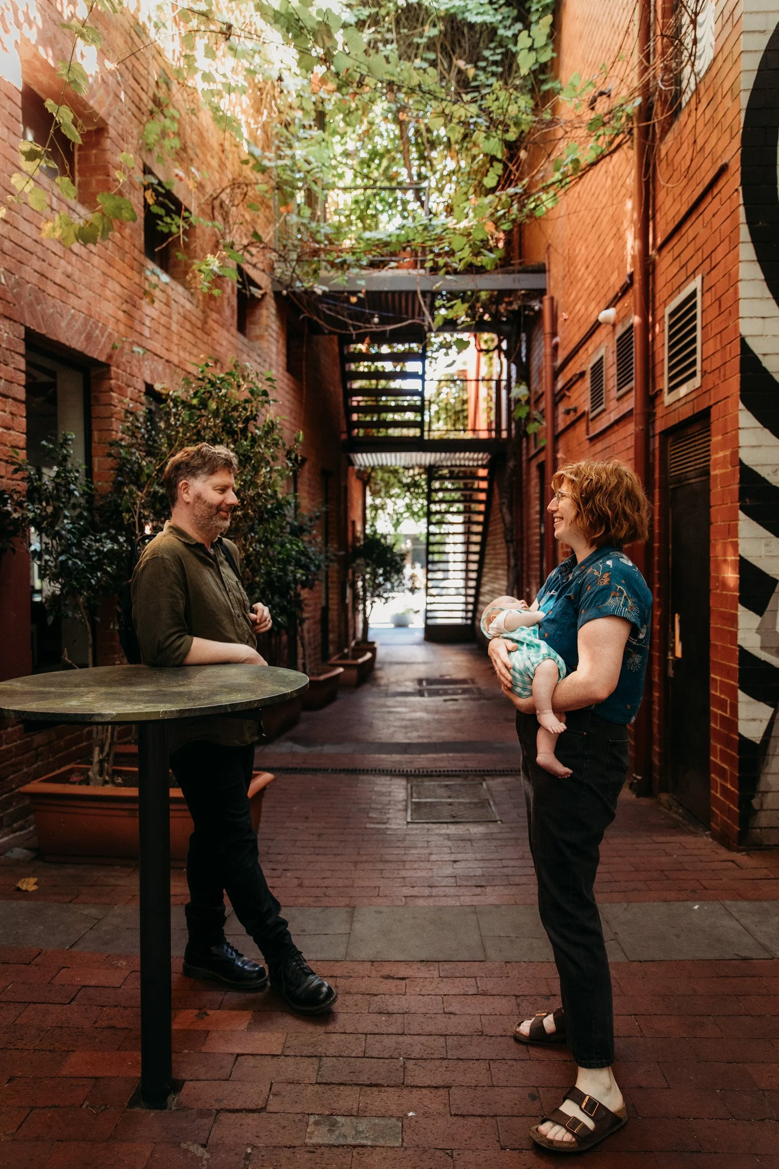 adelaide-family-photographer-parents-with-baby-laneway.jpg