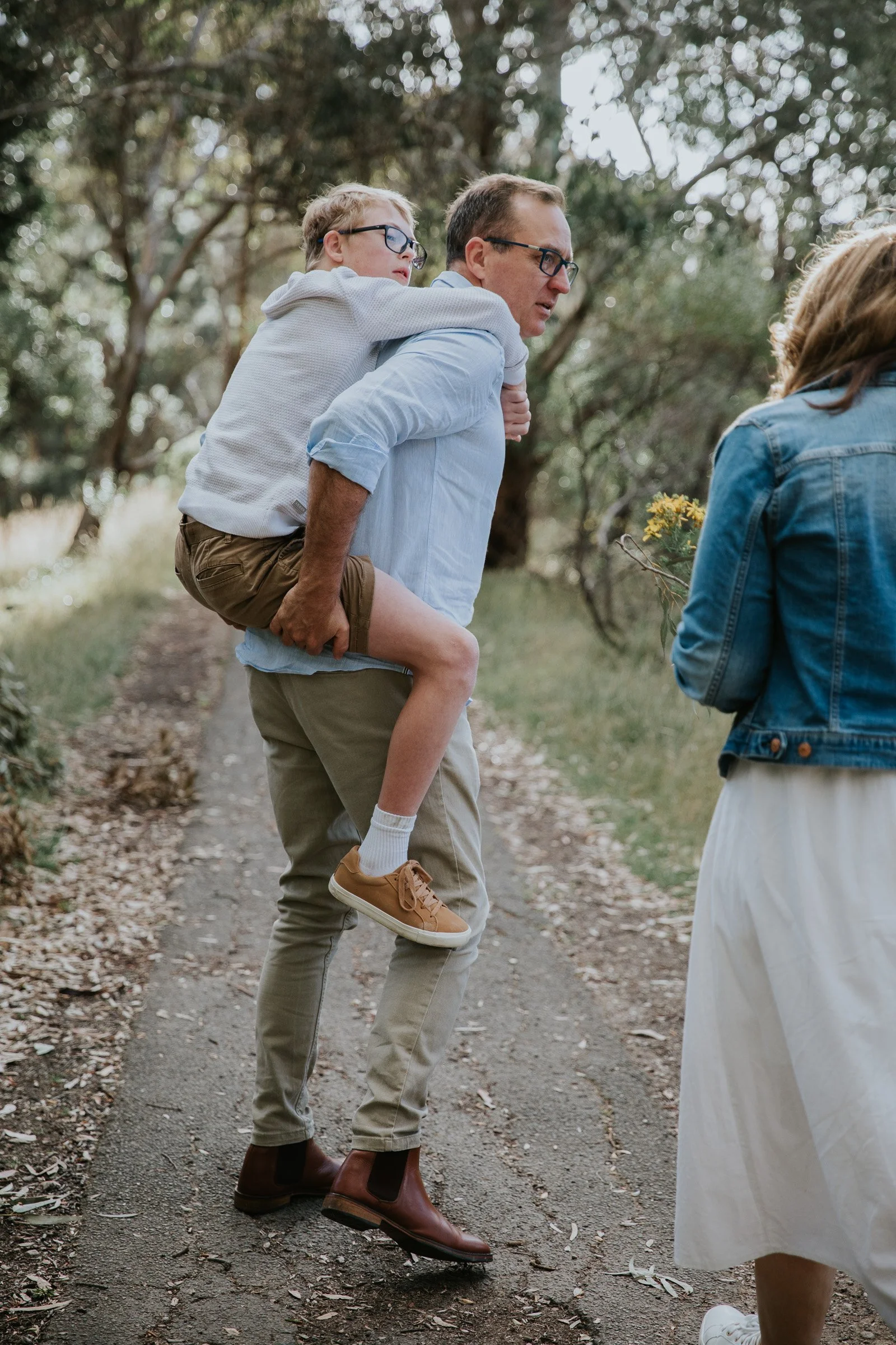 adelaide-family-photographer-dad-piggyback-child.jpg