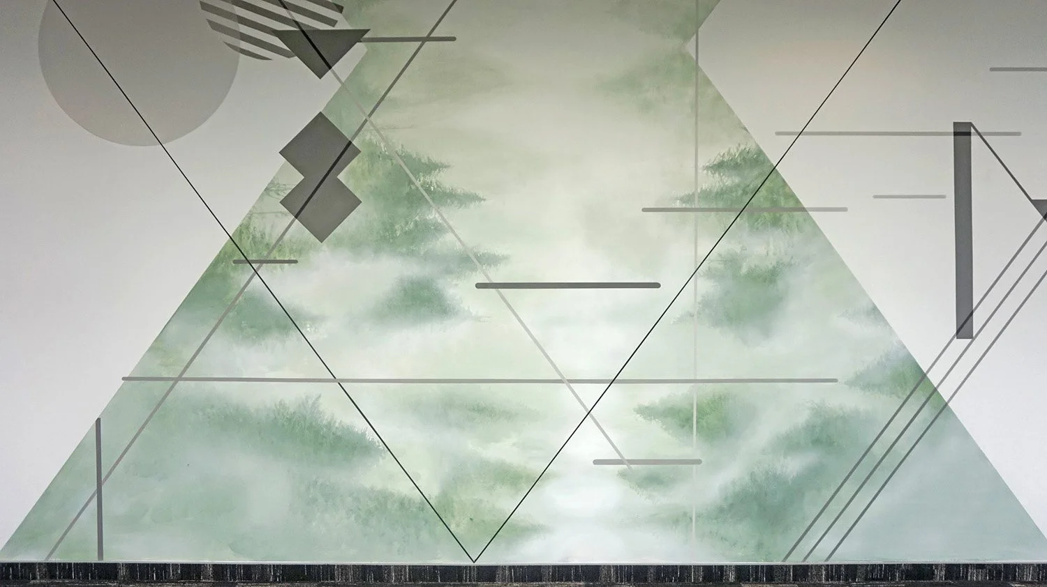 Abstract artwork with geometric lines, shapes, and a central triangular design overlaid on a background of green trees and sky.