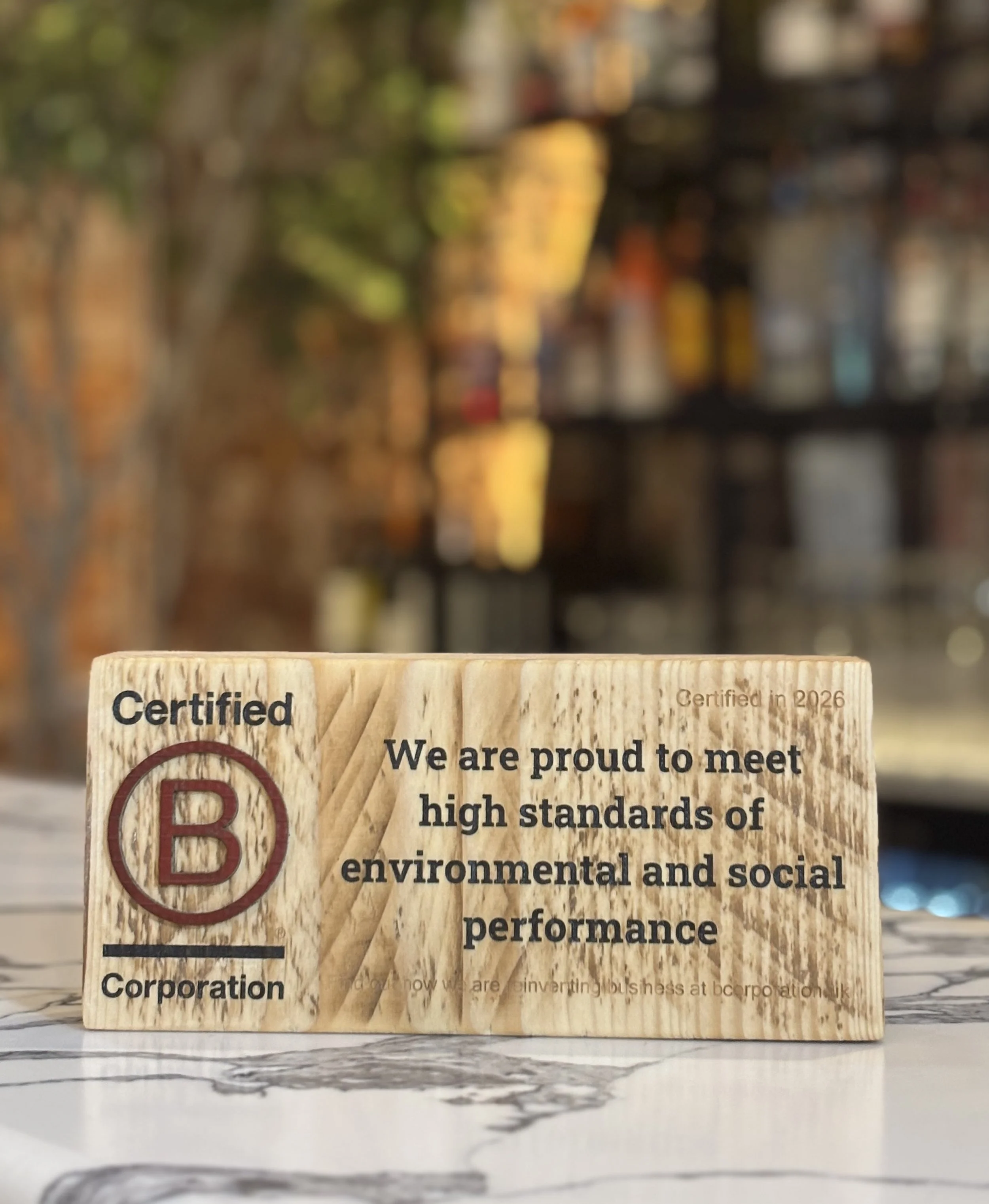 B Corp Plaque on a bar top