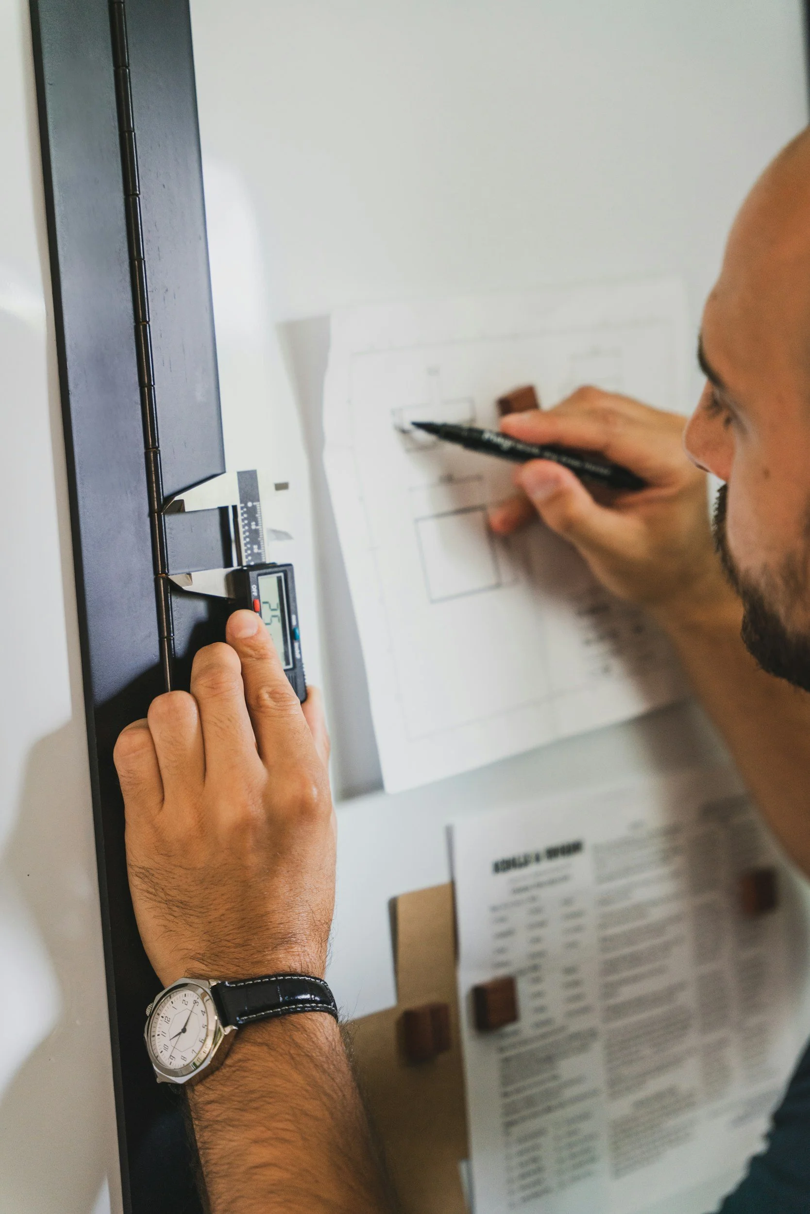 Product engineer checking measurements against a technical drawing