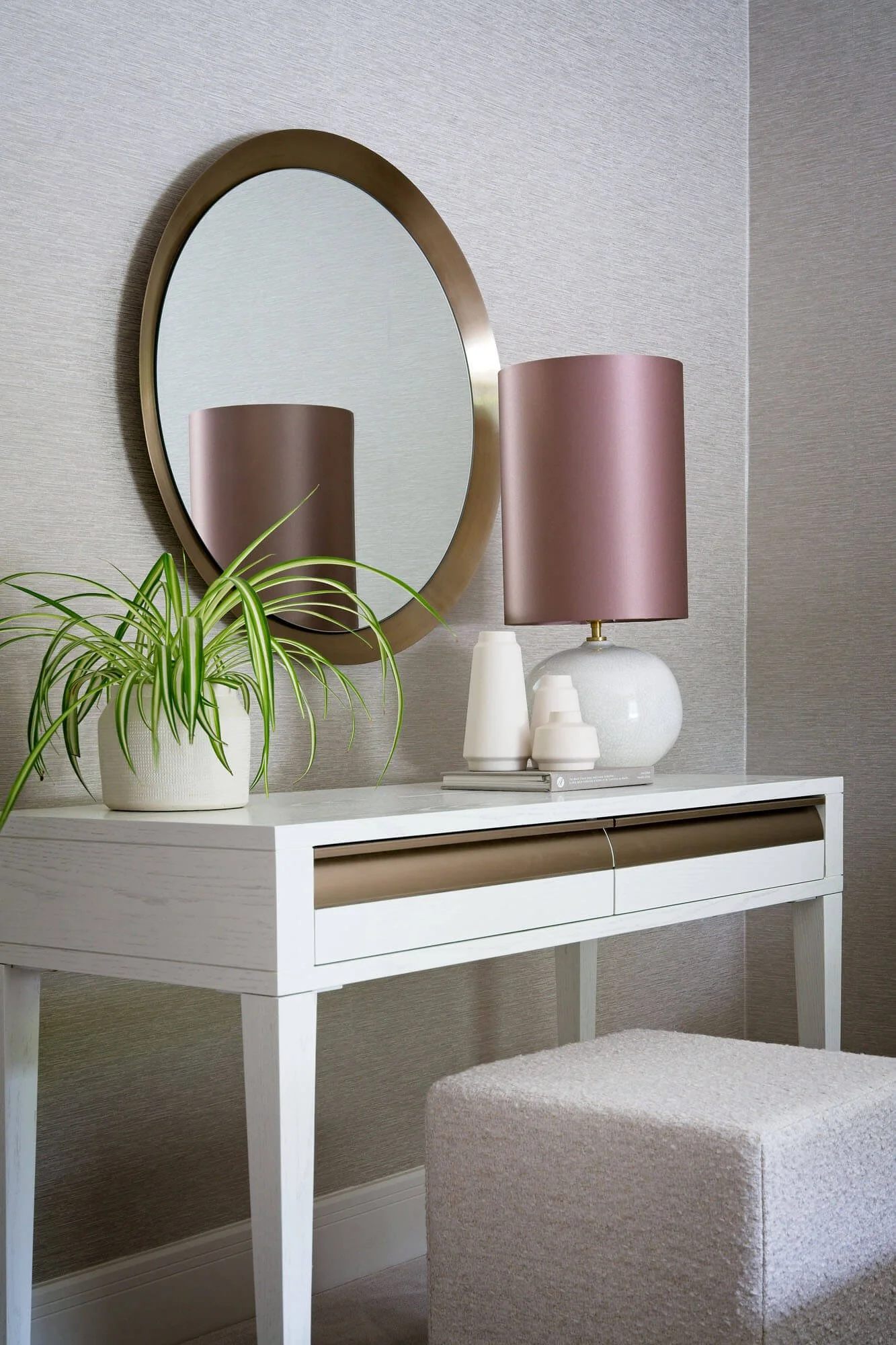Cream dressing area with soft textures and pink accents