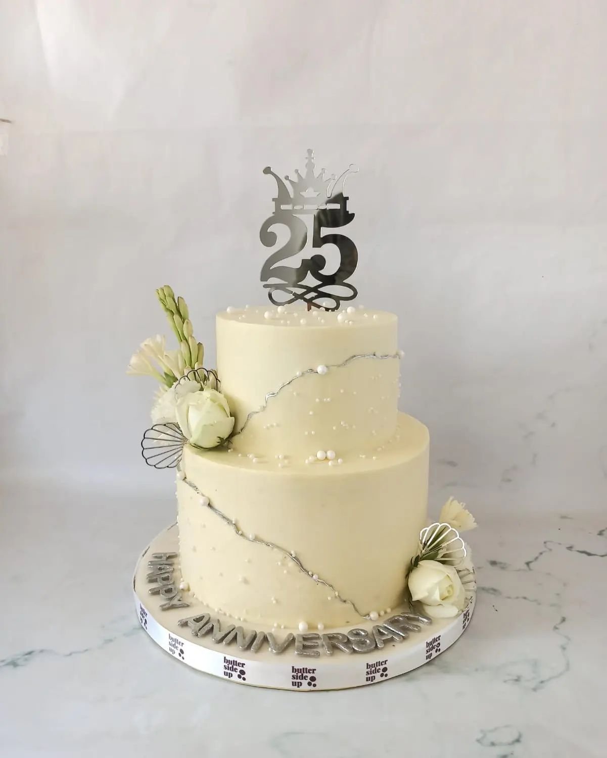 Simple 25th wedding anniversary cake
[ buttercream cakes, two tier cake, acrylic topper, real flowers]