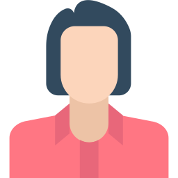 A person with shoulder-length dark hair wearing a pink shirt and a light-colored face, with no facial features visible.