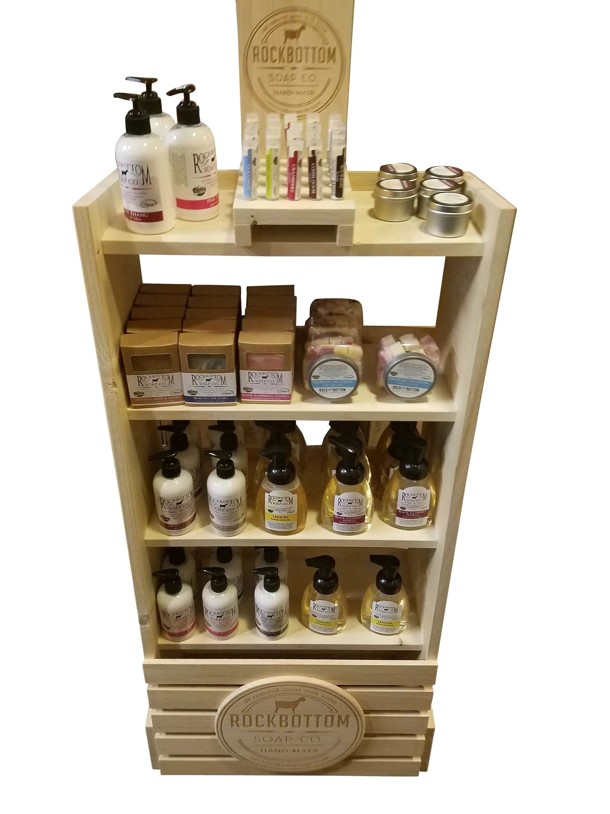 Pine floor display with shelves and an etched logo emblem