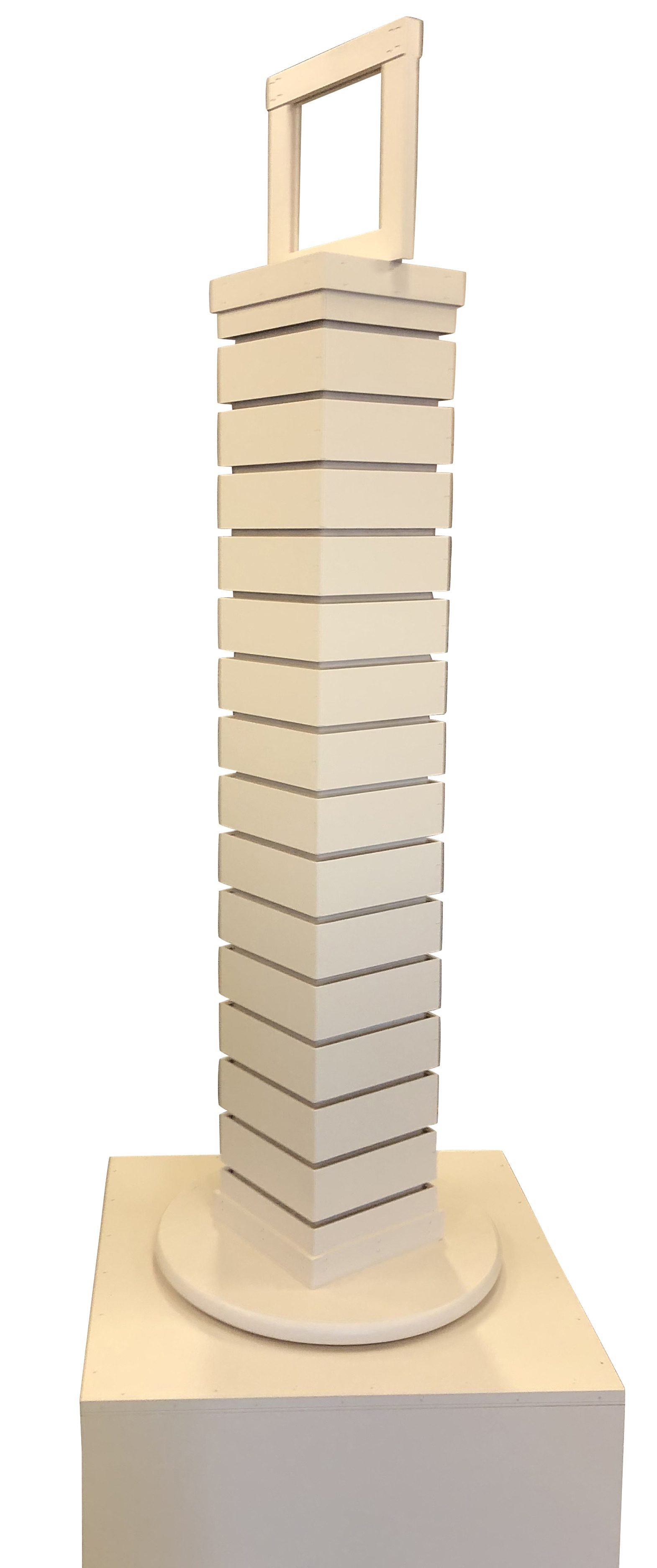 Rotating slatwall tower display on a round base