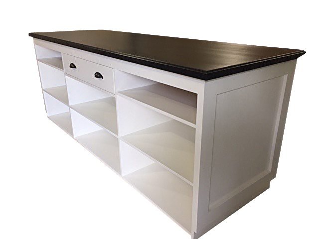 White checkout counter with drawer and walnut top