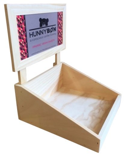Pine tray-style candy display with color vinyl sign