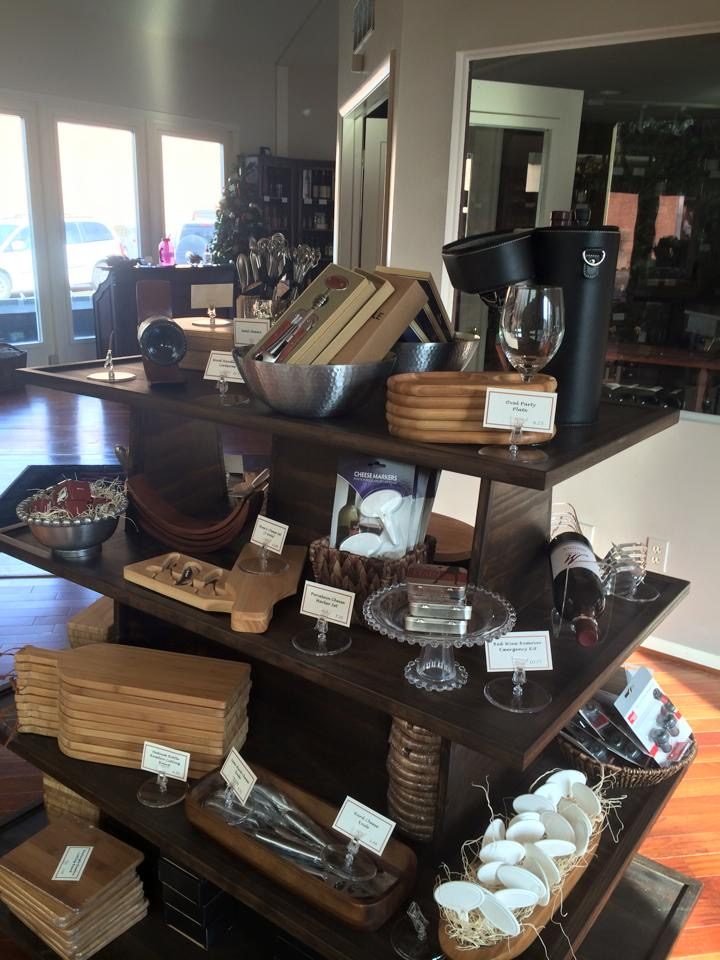 Dark walnut island gondola displaying kitchen and gift items