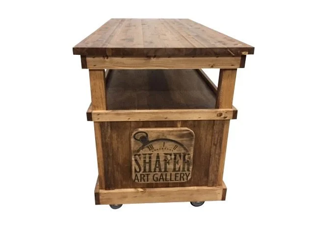 Rolling cart with open shelf and cabinet storage for a gallery shop