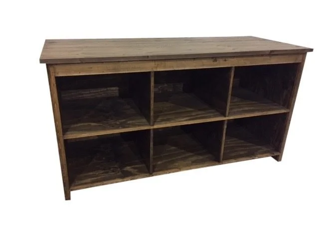 Stained cash wrap counter with open storage cubbies on the back