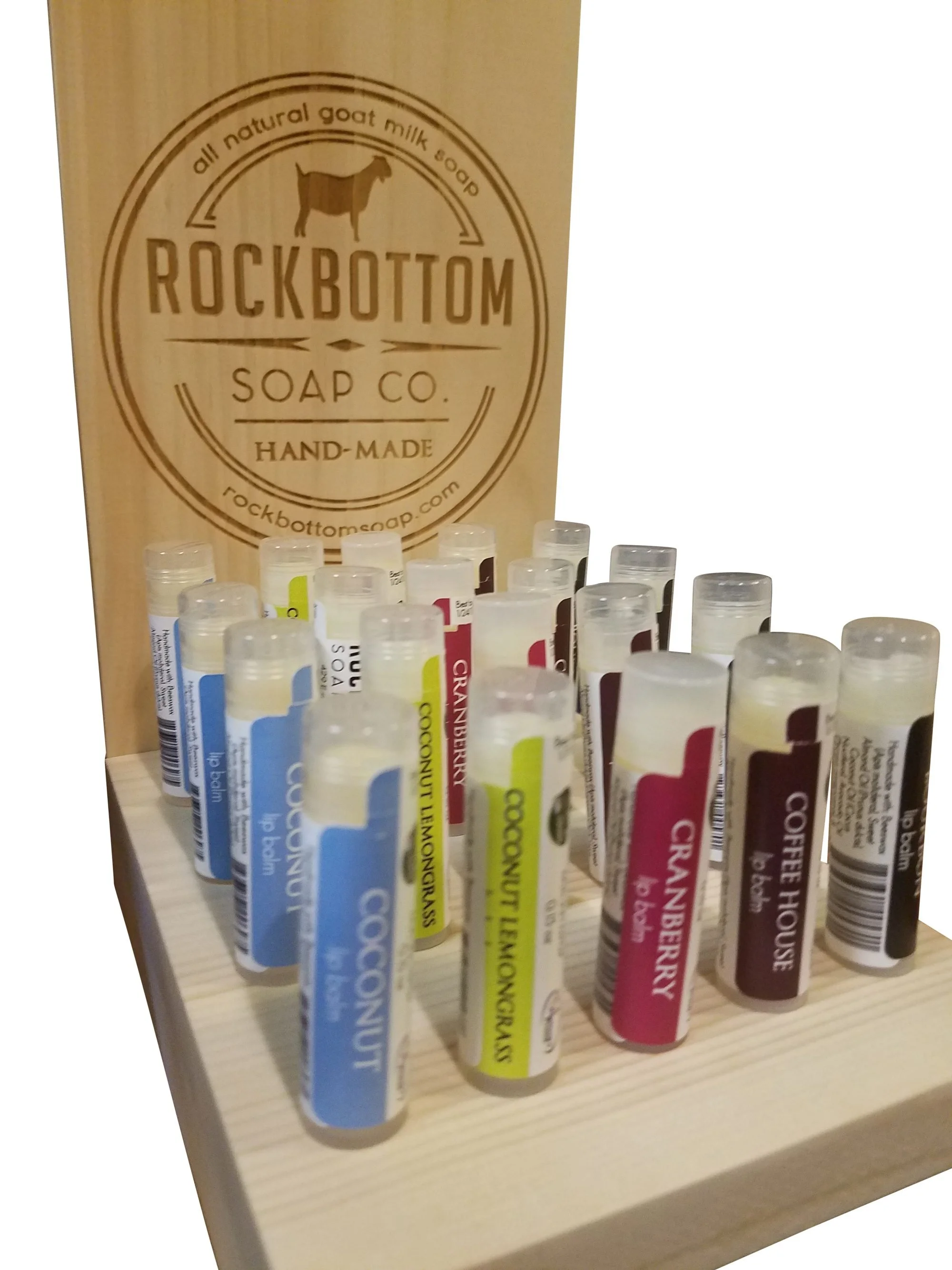 Countertop lip balm display with etched logo back panel