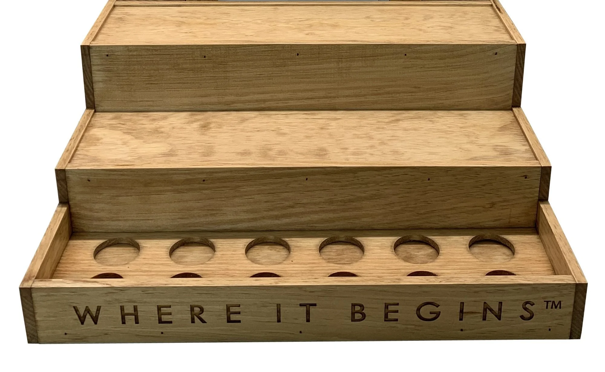 Three-tier stair-step bottle display with routed holes and etched front