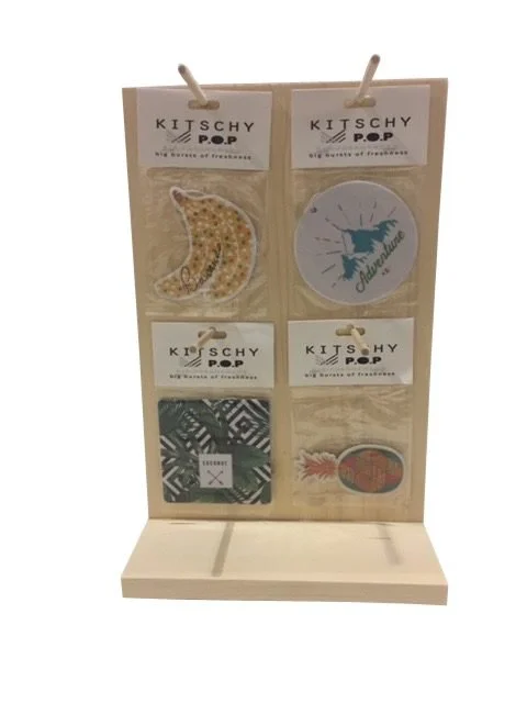Pine countertop peg display with printed product cards