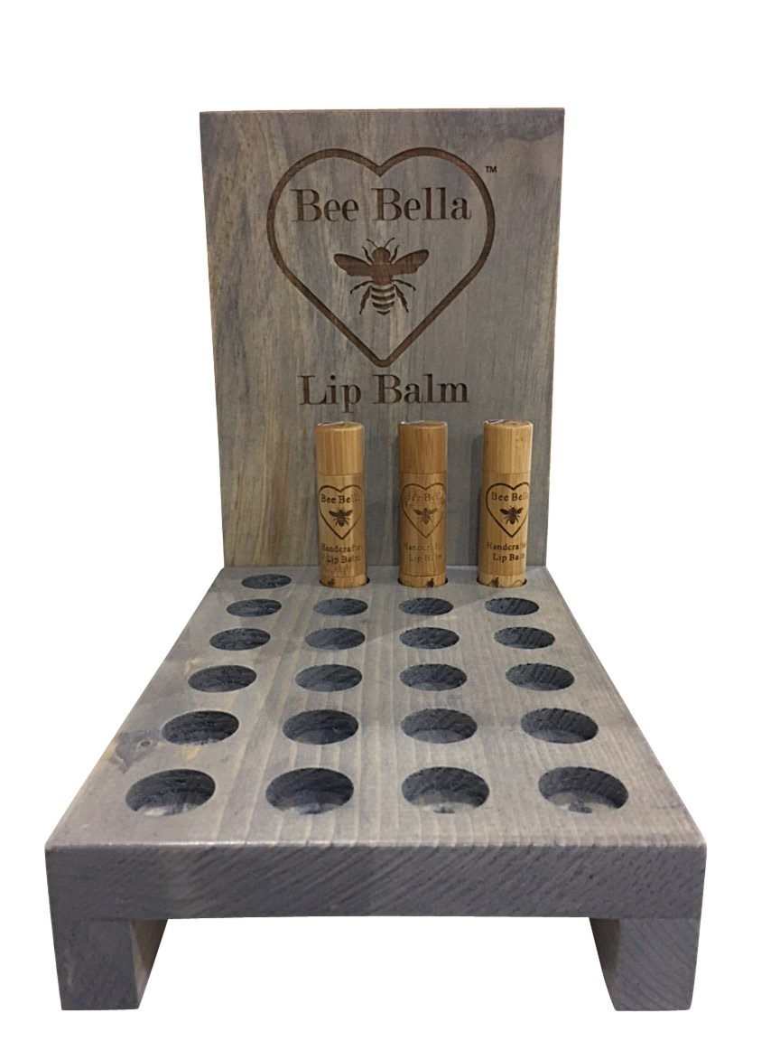 Stained lip balm display with routed holes and etched header
