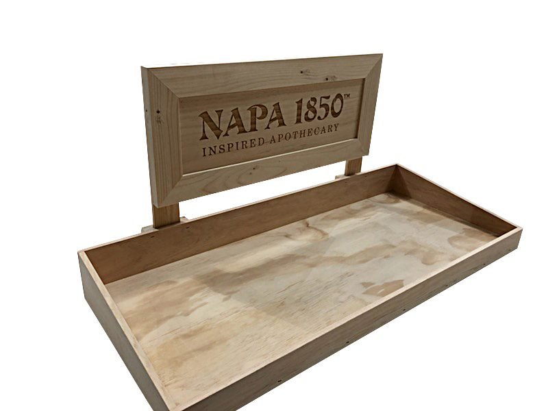 Tray-style counter display with branded header sign