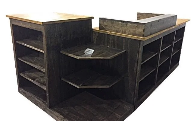 Dark stained L-shaped cash wrap with corner display shelves