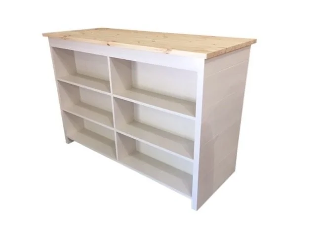 White cash wrap counter with front display shelves