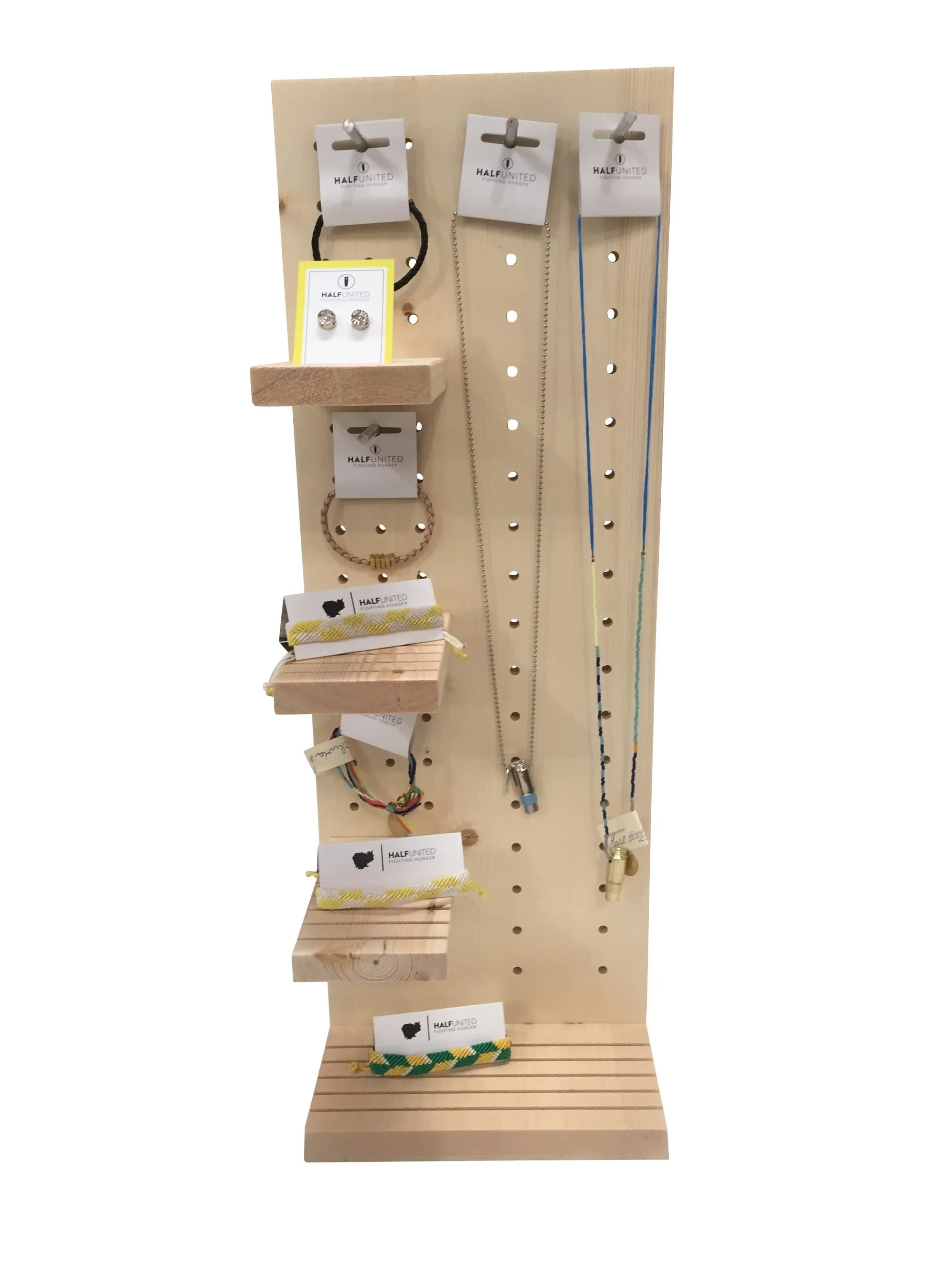 Countertop jewelry display with shelves and hanging pegs