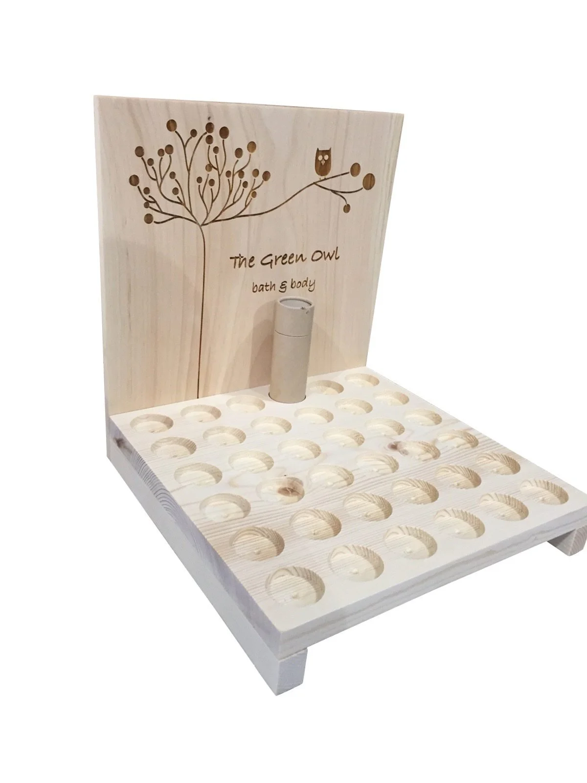 Countertop display with routed holes for lip balm and lotion tubes