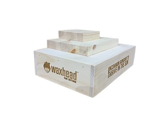 Tiered white countertop display with printed branding
