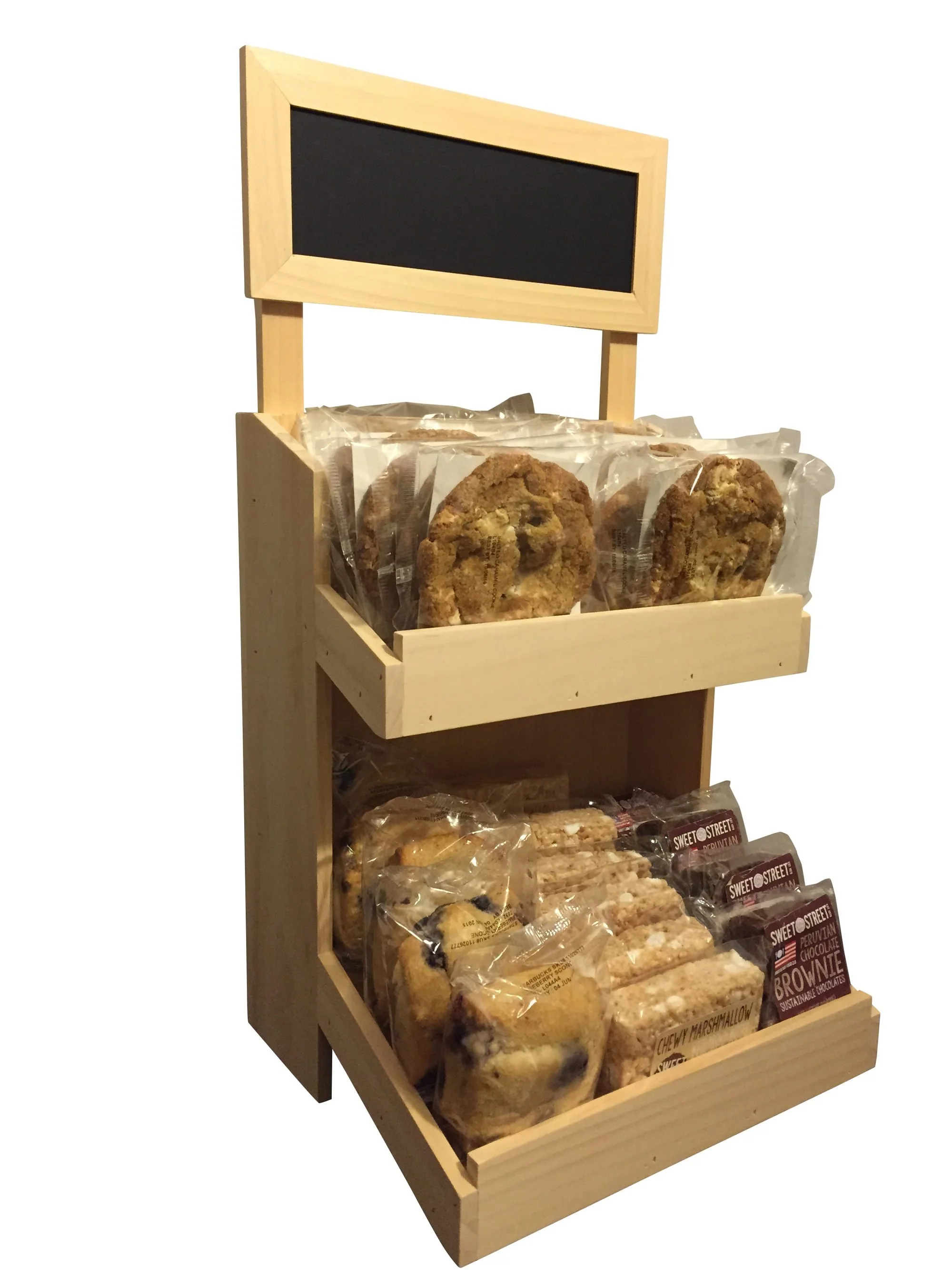 Two-tier slanted shelf display for baked goods with chalkboard sign
