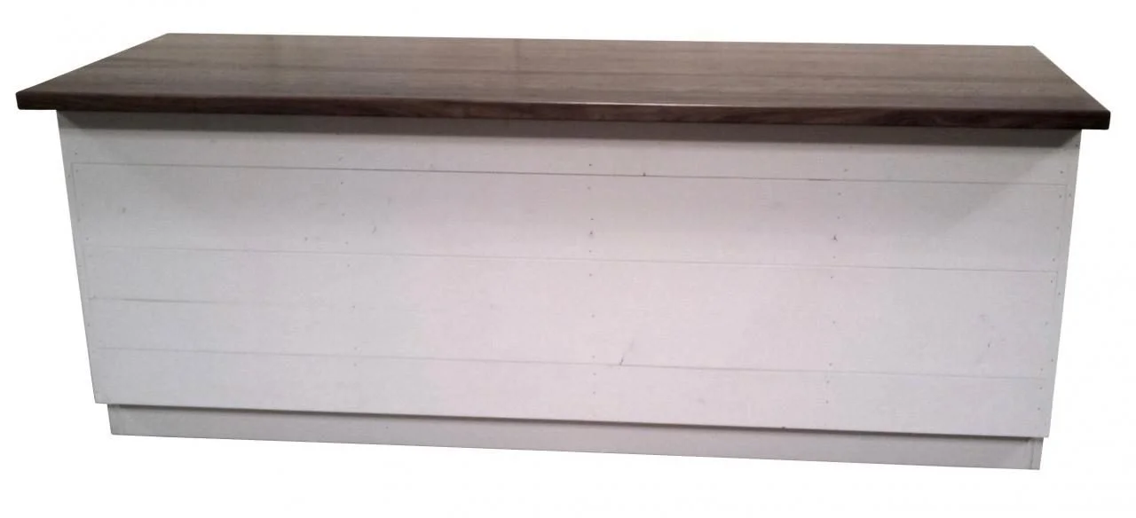 White sales counter with walnut top, drawer and open shelves
