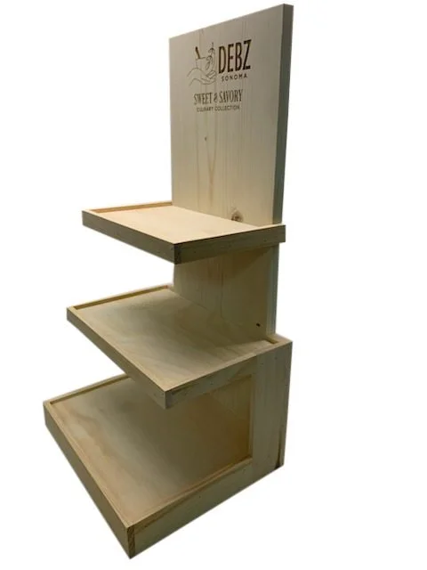 Pine countertop shelf display with floating shelves and etched header