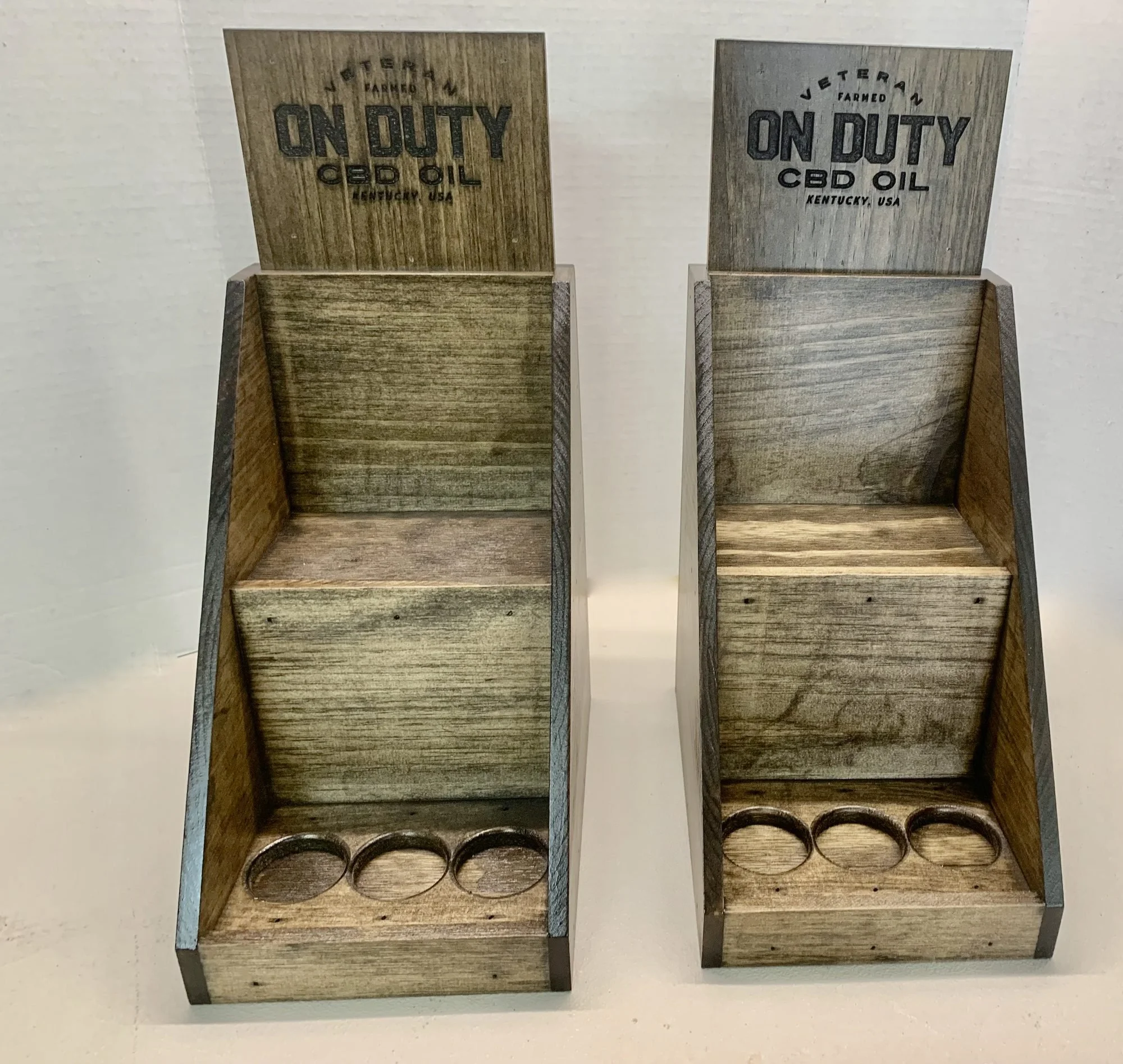 Stained countertop displays with routed bottle holes and etched headers