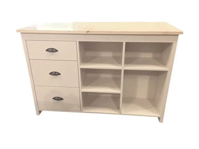 Cream sales counter with drawers and open shelf storage